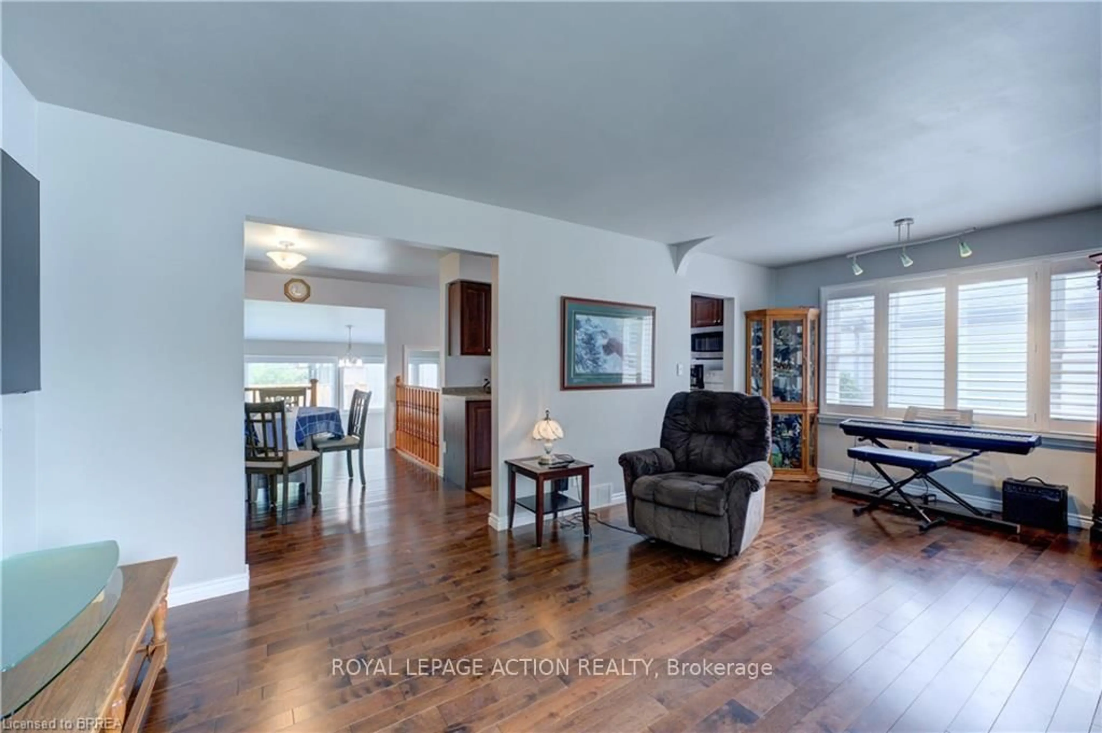 Living room with furniture, wood/laminate floor for 36 Grove Cres, Brantford Ontario N3R 4Y4