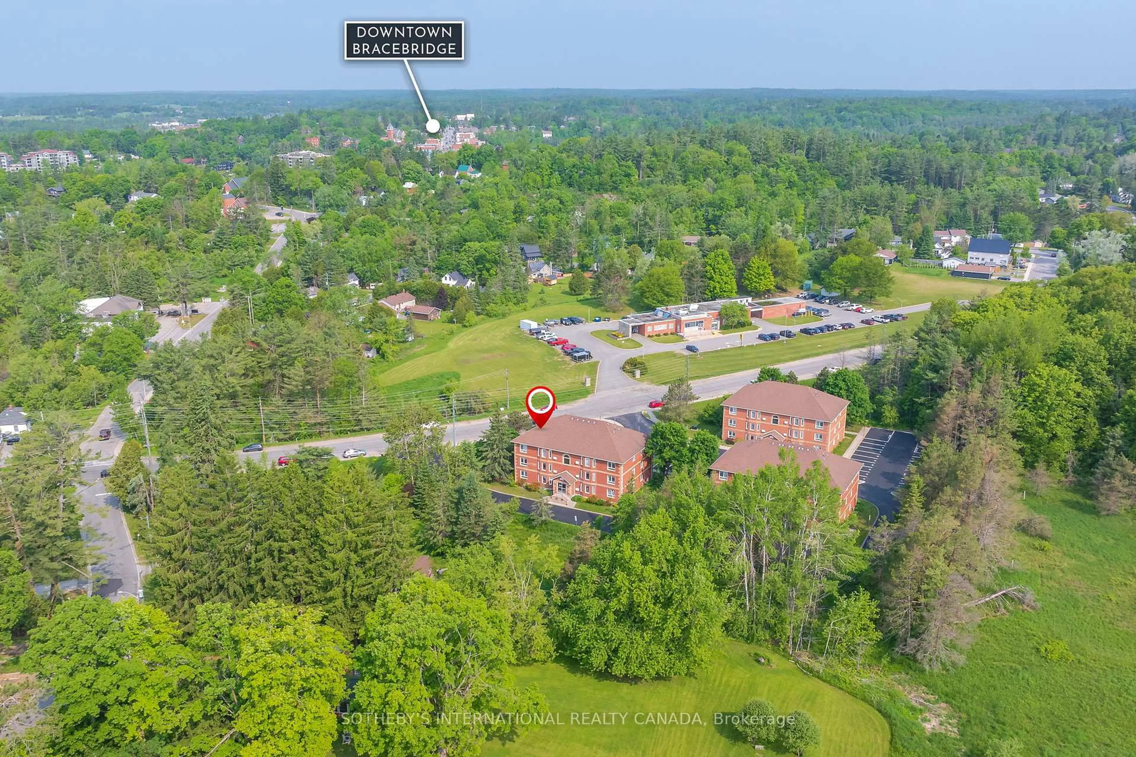 A pic from outside/outdoor area/front of a property/back of a property/a pic from drone, mountain view for 661 Cedar Lane #201C, Bracebridge Ontario P1L 1N9