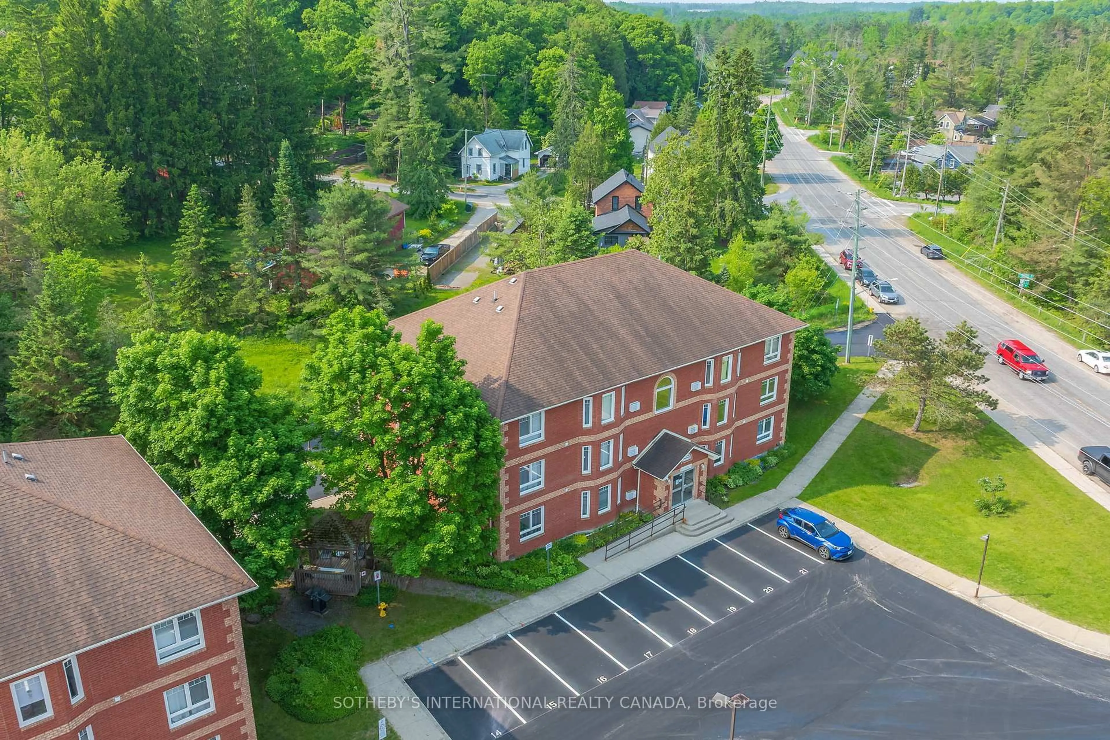 A pic from outside/outdoor area/front of a property/back of a property/a pic from drone, unknown for 661 Cedar Lane #201C, Bracebridge Ontario P1L 1N9