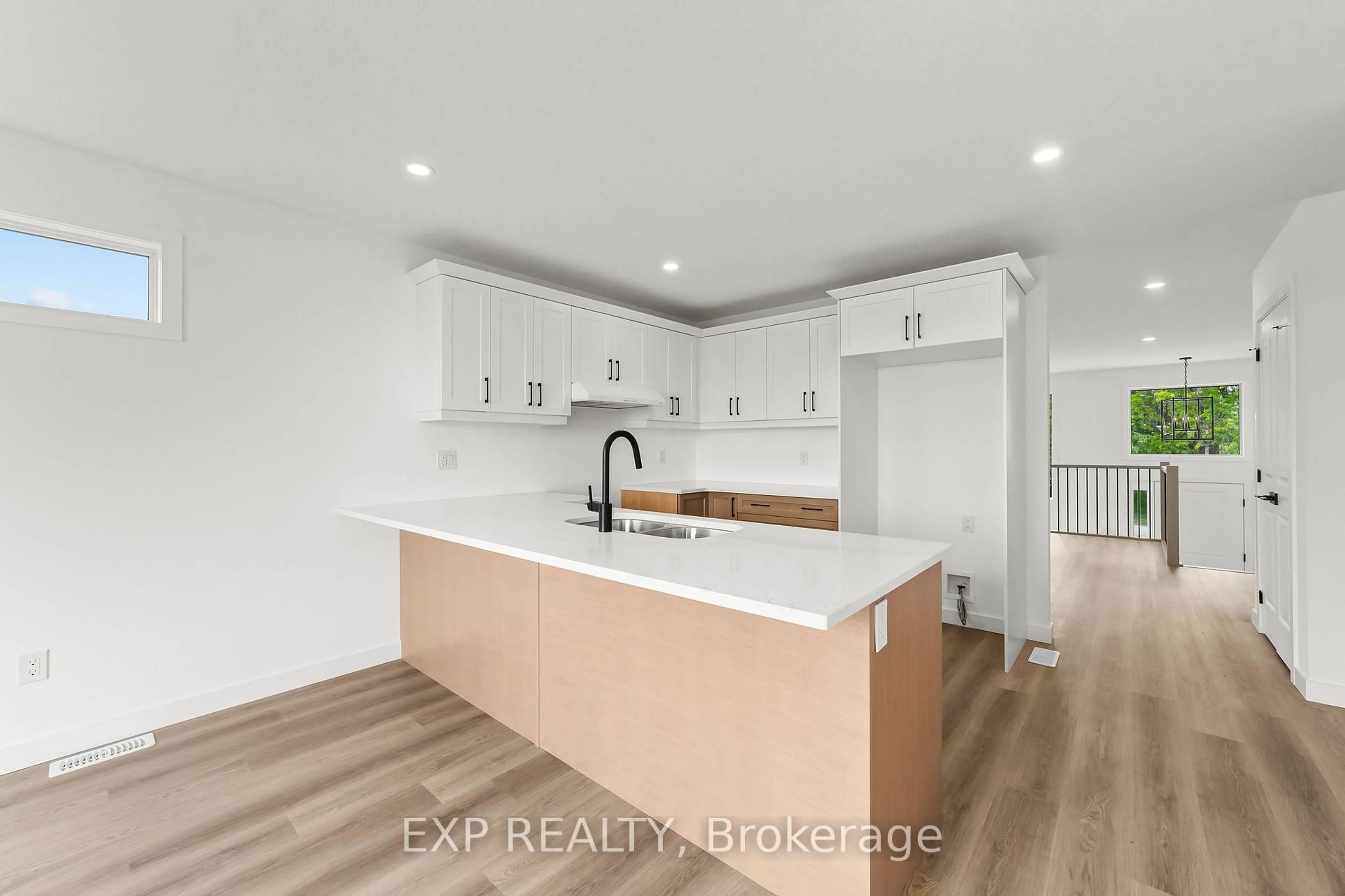 Open concept kitchen, wood/laminate floor for 1552 Melwood Dr, St. Clair Ontario N0N 1B0