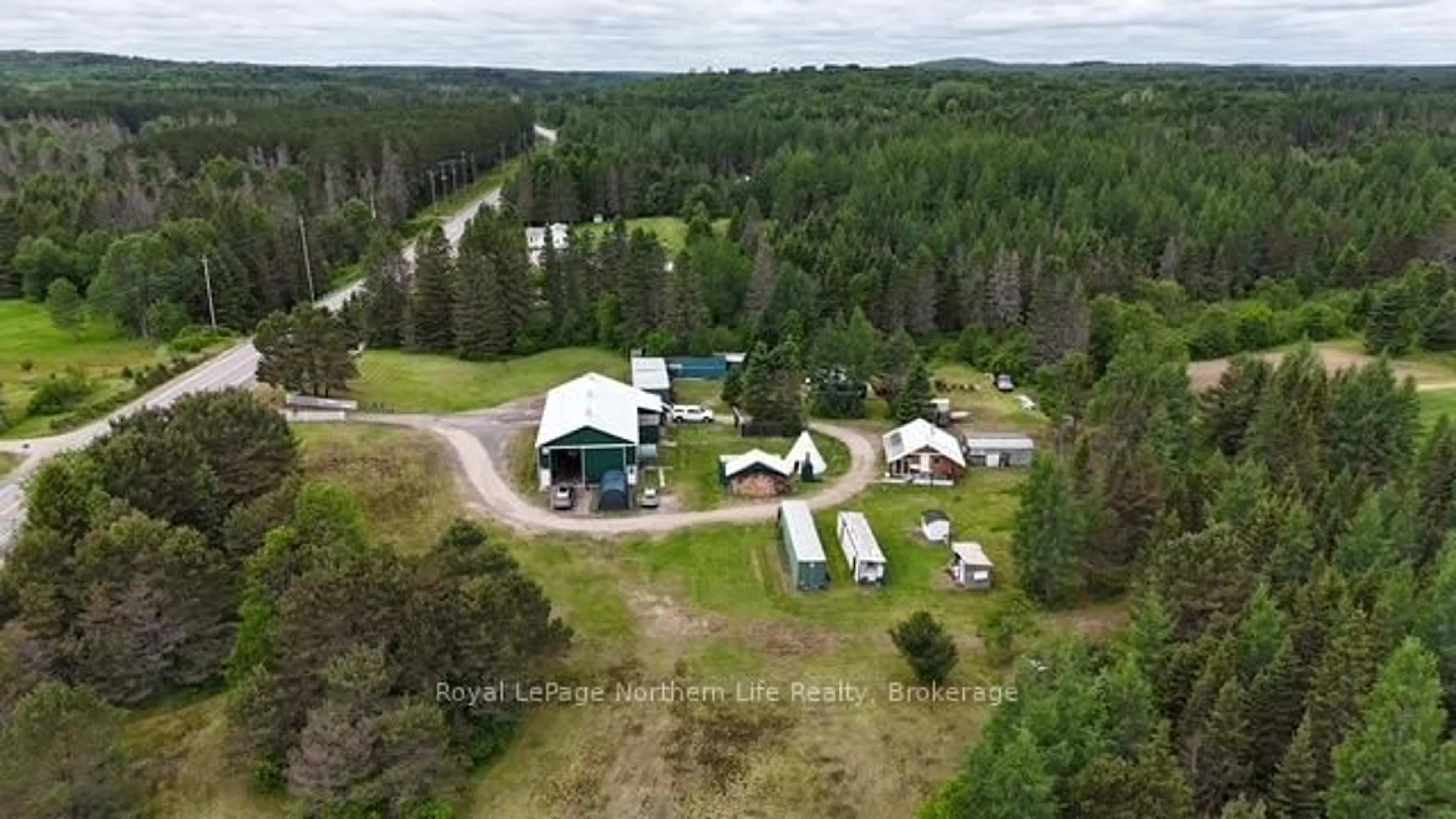 A pic from outside/outdoor area/front of a property/back of a property/a pic from drone, forest/trees view for 970 Highway 522, Powassan Ontario P0H 2L0