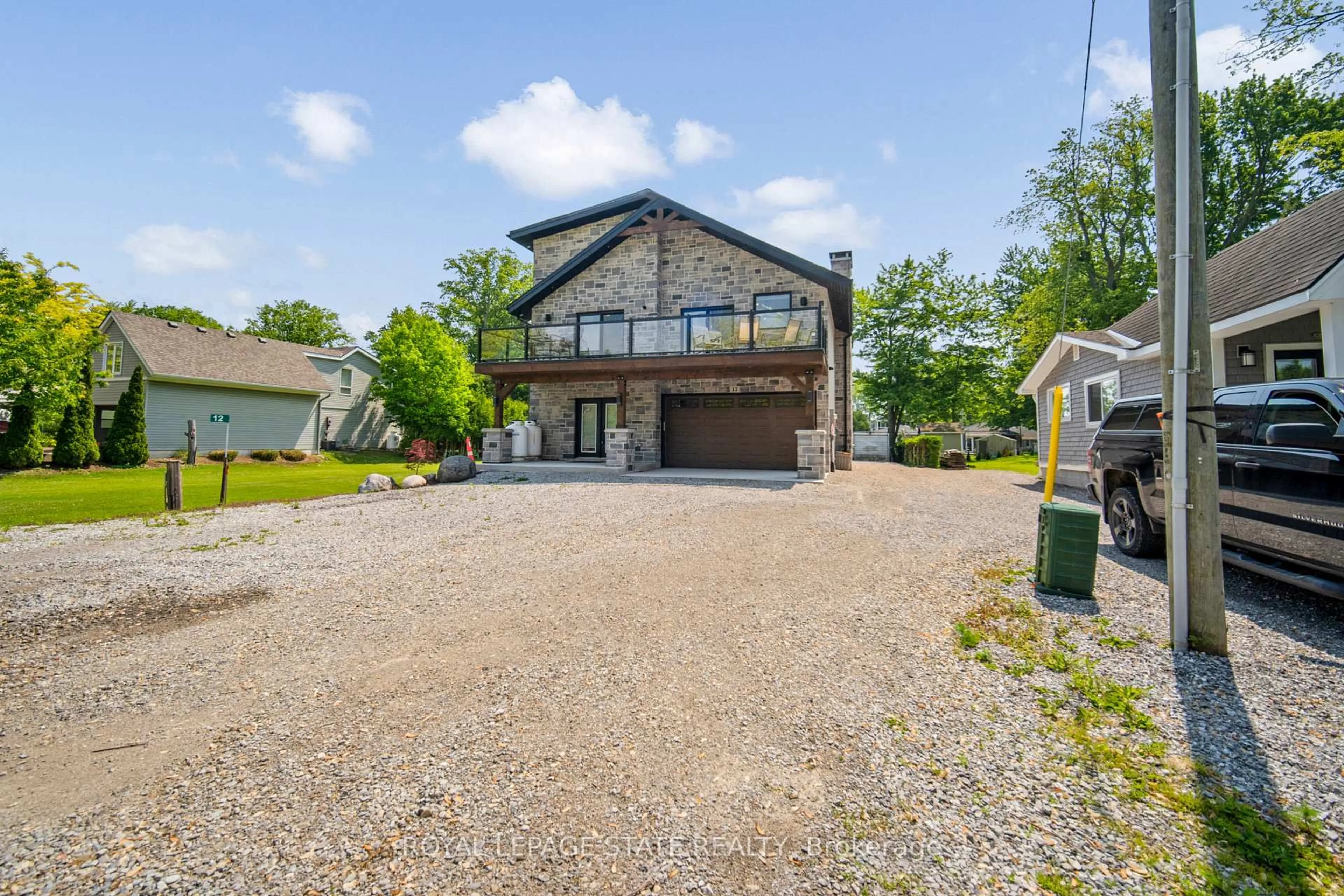 A pic from outside/outdoor area/front of a property/back of a property/a pic from drone, unknown for 12 Park Lane Cres, Norfolk Ontario N0E 1T0