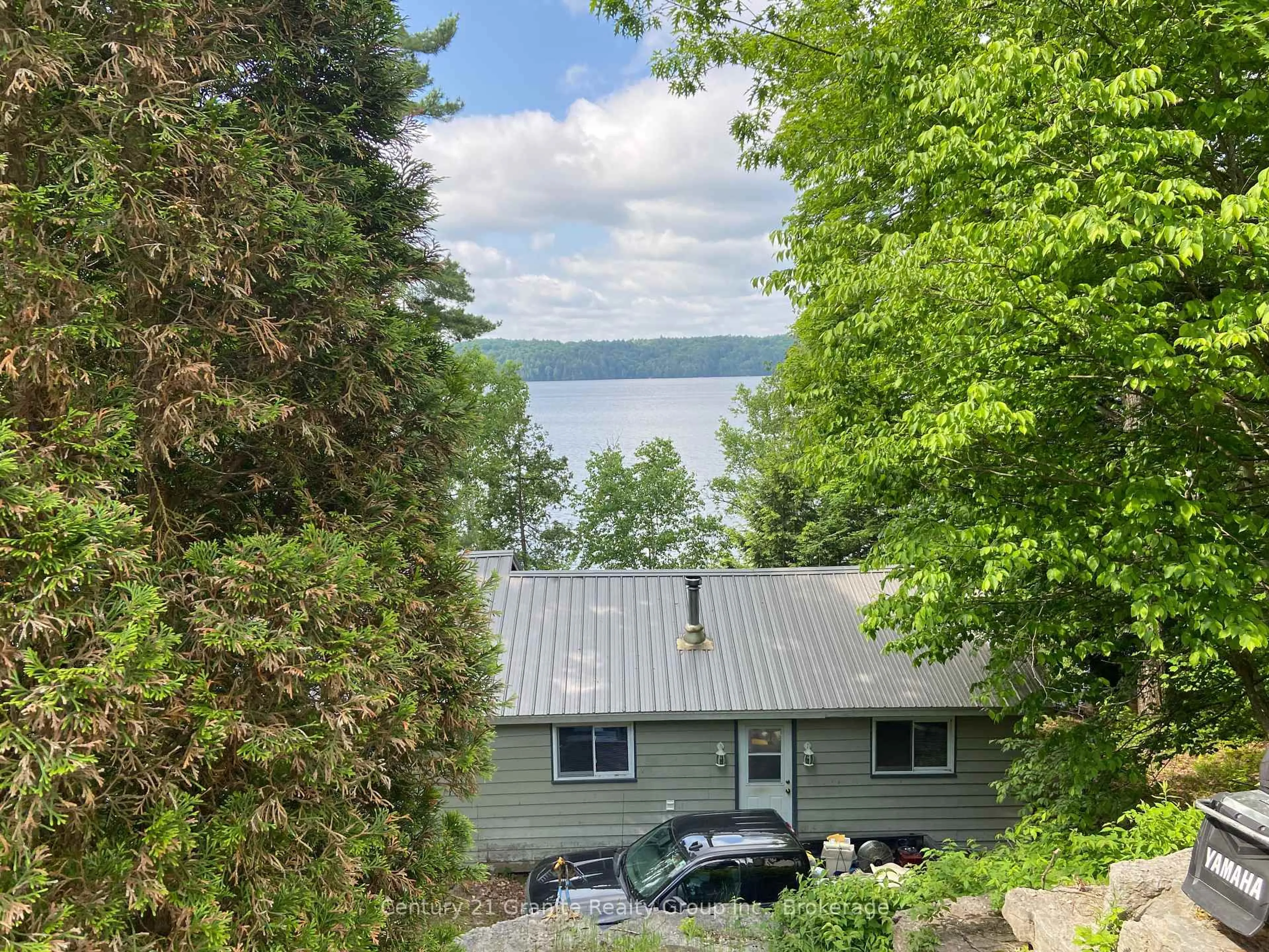 A pic from outside/outdoor area/front of a property/back of a property/a pic from drone, water/lake/river/ocean view for 2346 Wilkinson Dr, Dysart et al Ontario K0M 1S0