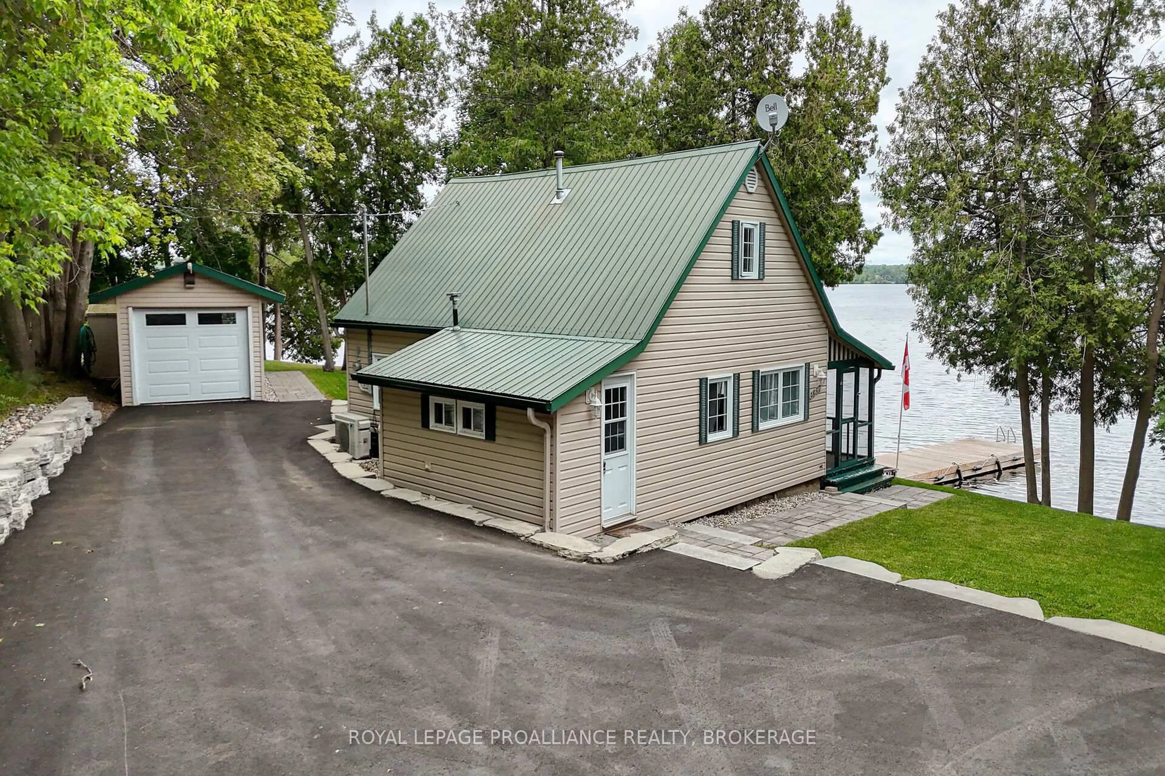 A pic from outside/outdoor area/front of a property/back of a property/a pic from drone, water/lake/river/ocean view for 3857 Corkey Rd, Frontenac Ontario H0H 1X0