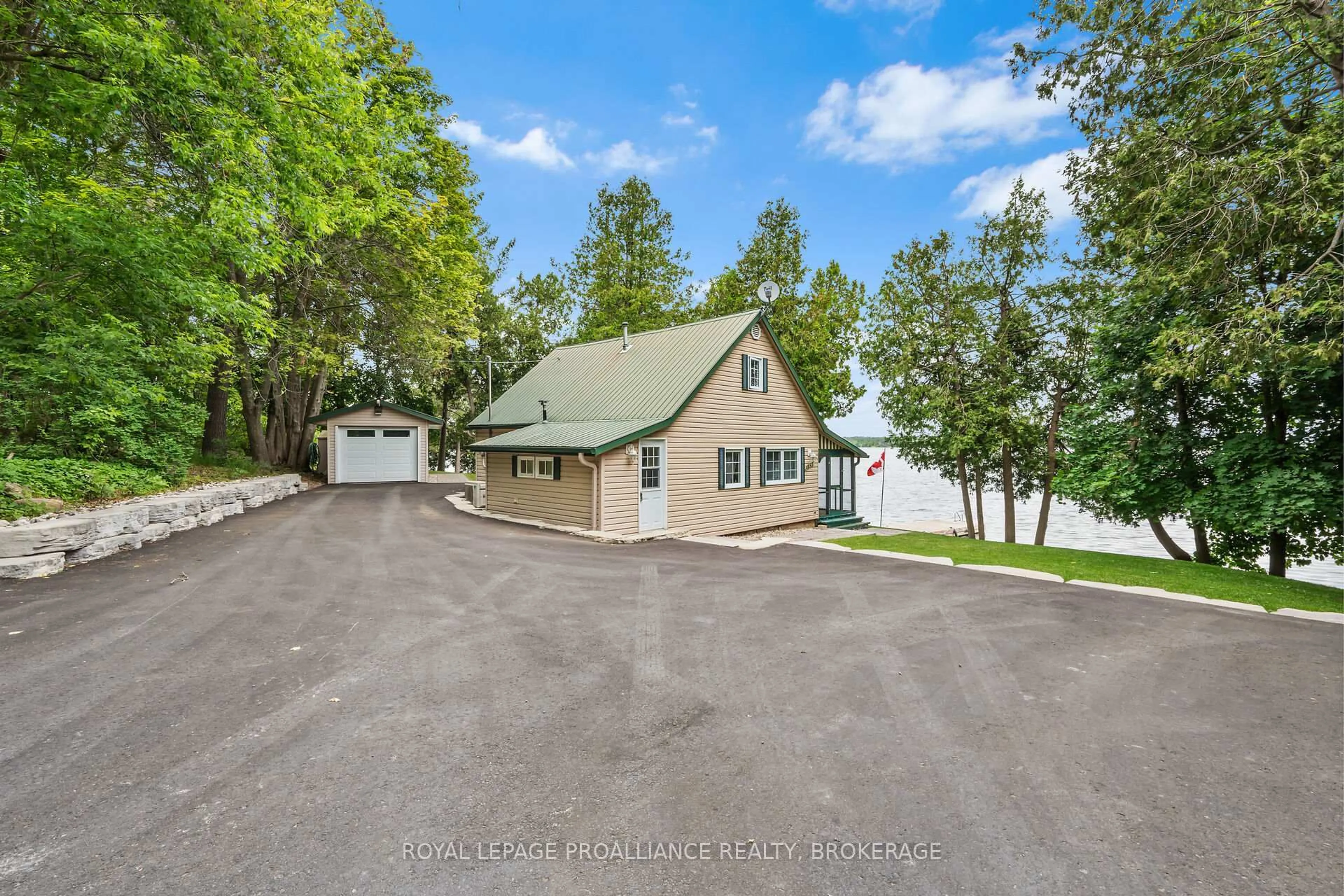 A pic from outside/outdoor area/front of a property/back of a property/a pic from drone, water/lake/river/ocean view for 3857 Corkey Rd, Frontenac Ontario H0H 1X0