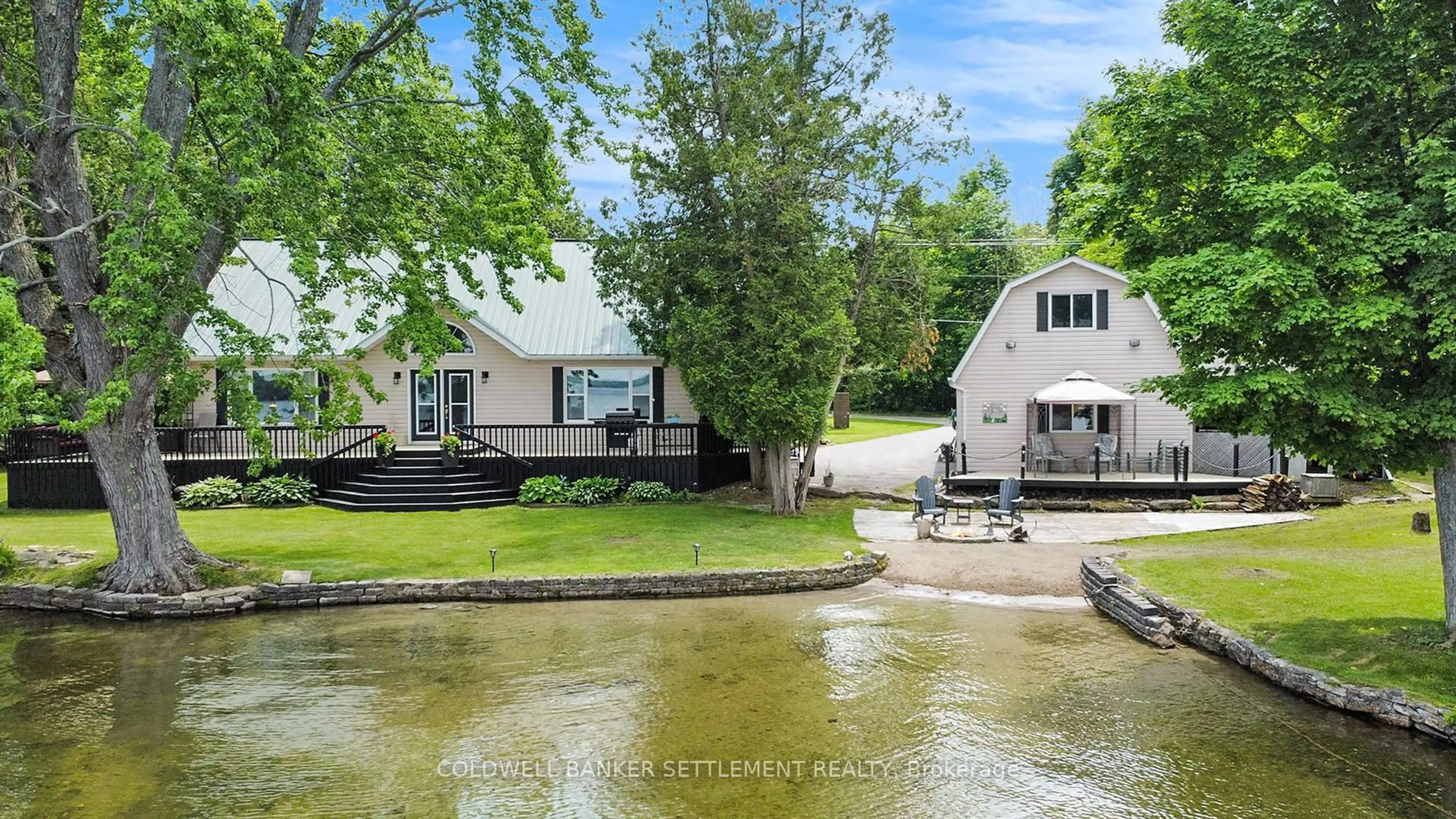 A pic from outside/outdoor area/front of a property/back of a property/a pic from drone, water/lake/river/ocean view for 14 R15 Rd, Rideau Lakes Ontario K0G 1L0