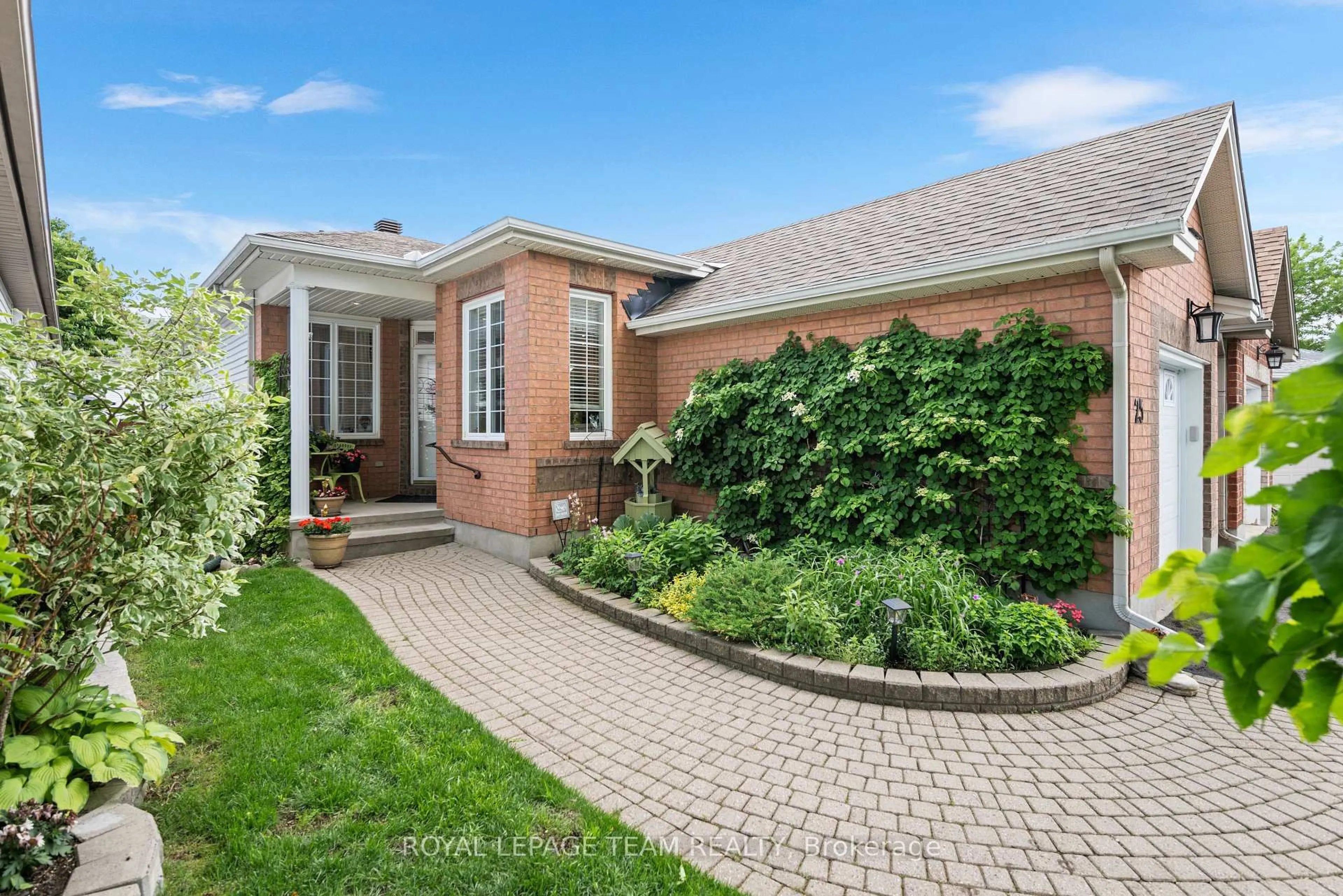 Home with brick exterior material, street for 25 Trump Ave, Ottawa Ontario K2C 4A7
