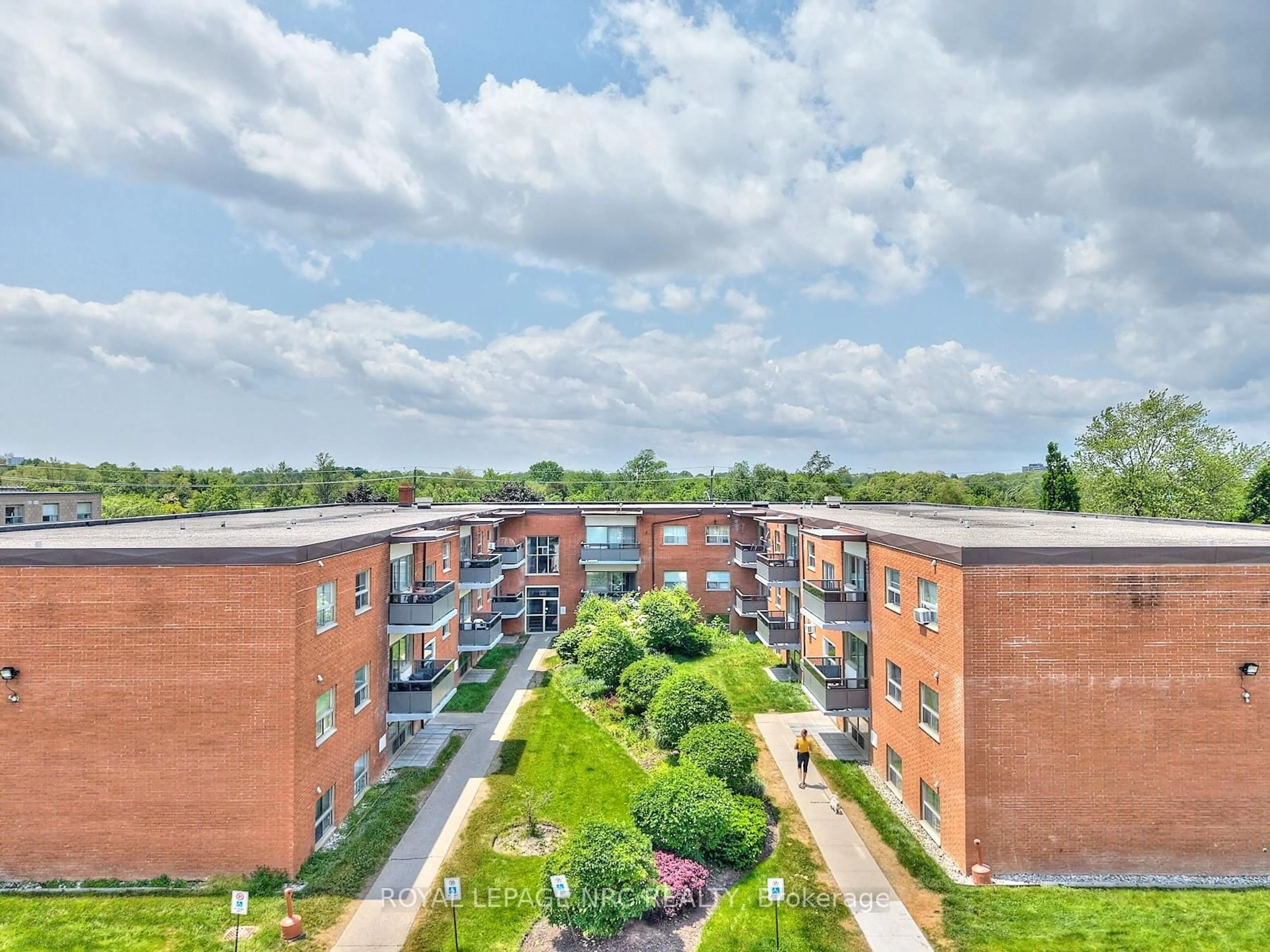 A pic from outside/outdoor area/front of a property/back of a property/a pic from drone, city buildings view from balcony for 242 Oakdale Ave #111, St. Catharines Ontario L2P 3K5