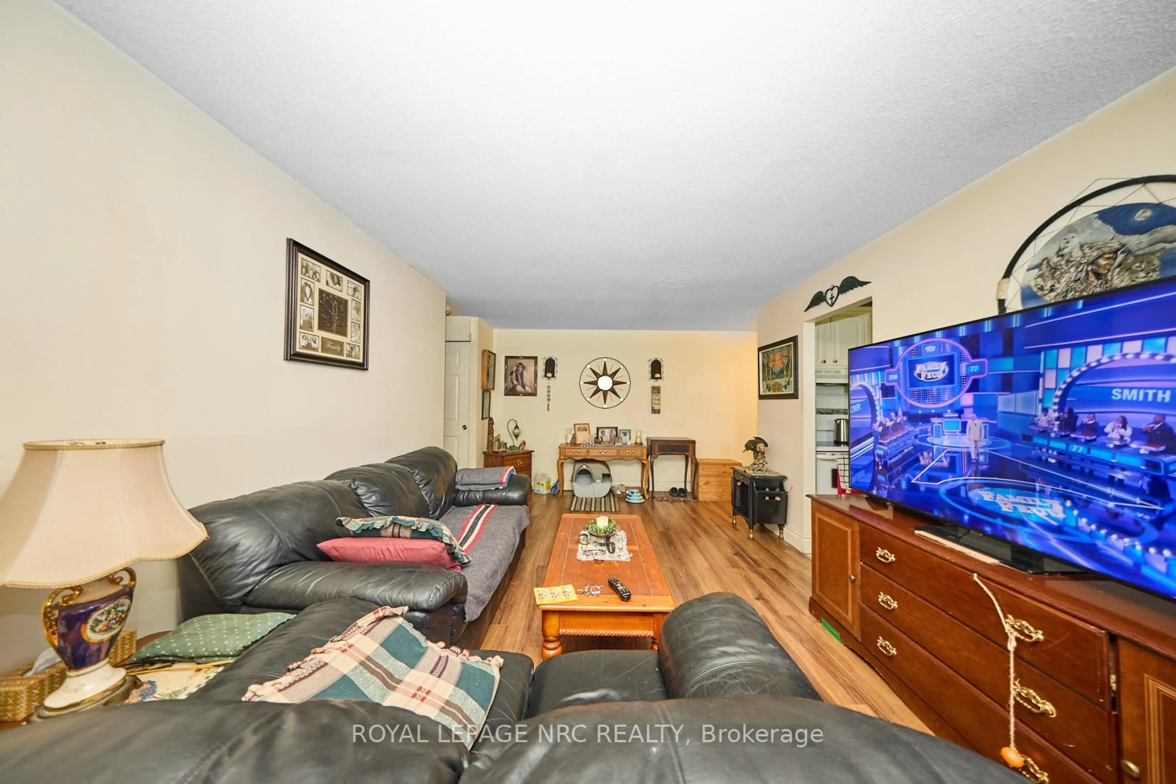 Living room with furniture, unknown for 242 Oakdale Ave #111, St. Catharines Ontario L2P 3K5