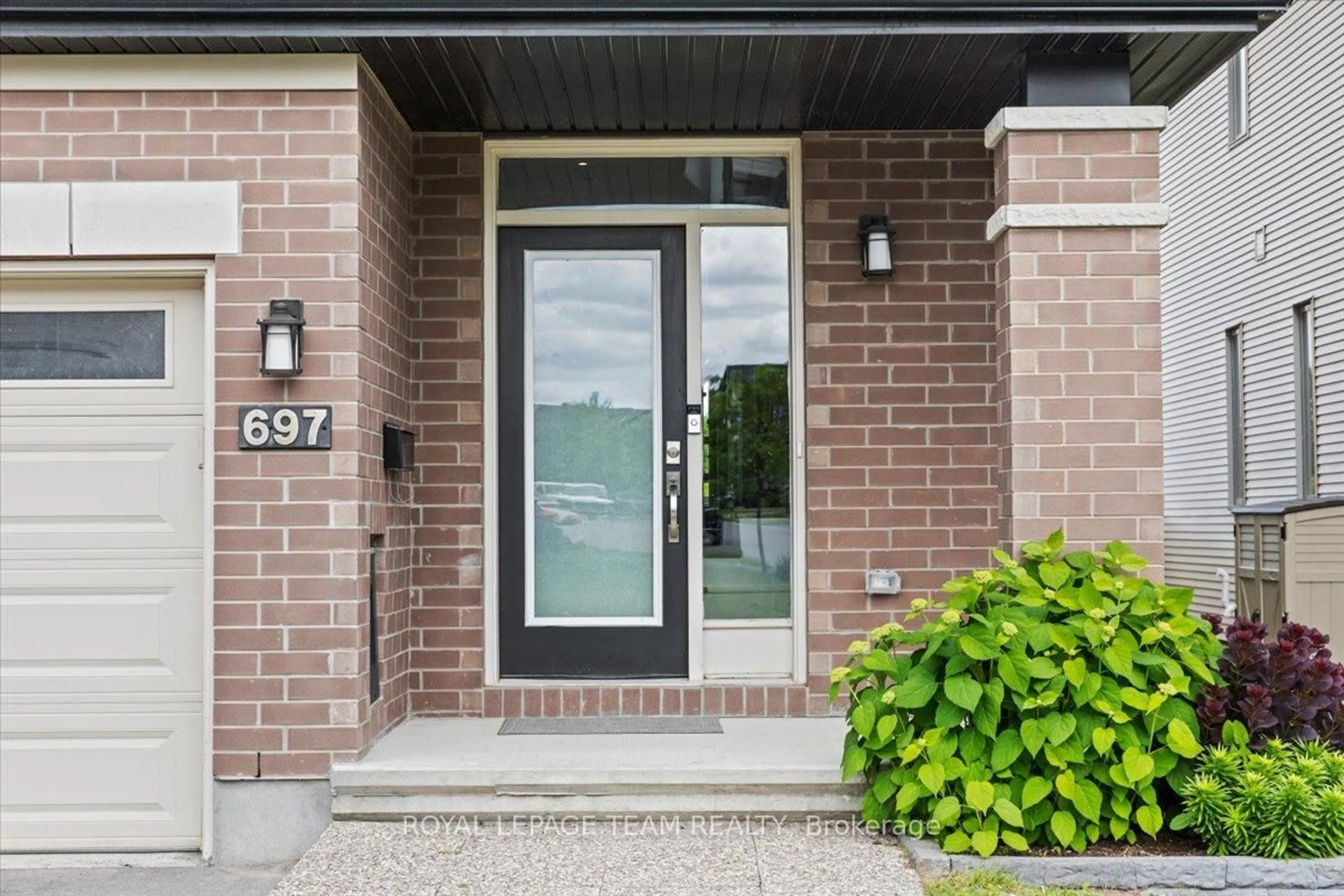 Home with brick exterior material, street for 697 Putney Cres, Ottawa Ontario K2S 2N9