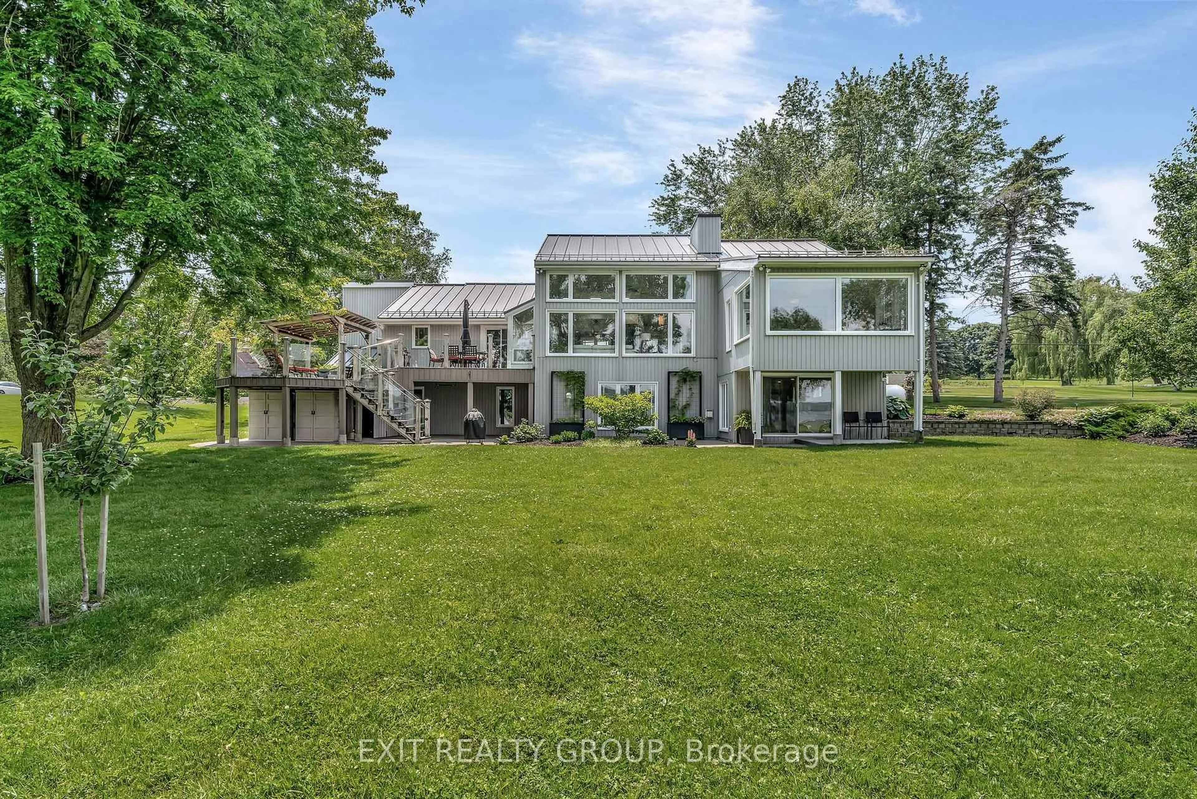 A pic from outside/outdoor area/front of a property/back of a property/a pic from drone, water/lake/river/ocean view for 652 County Rd 3, Prince Edward County Ontario K8N 4Z1