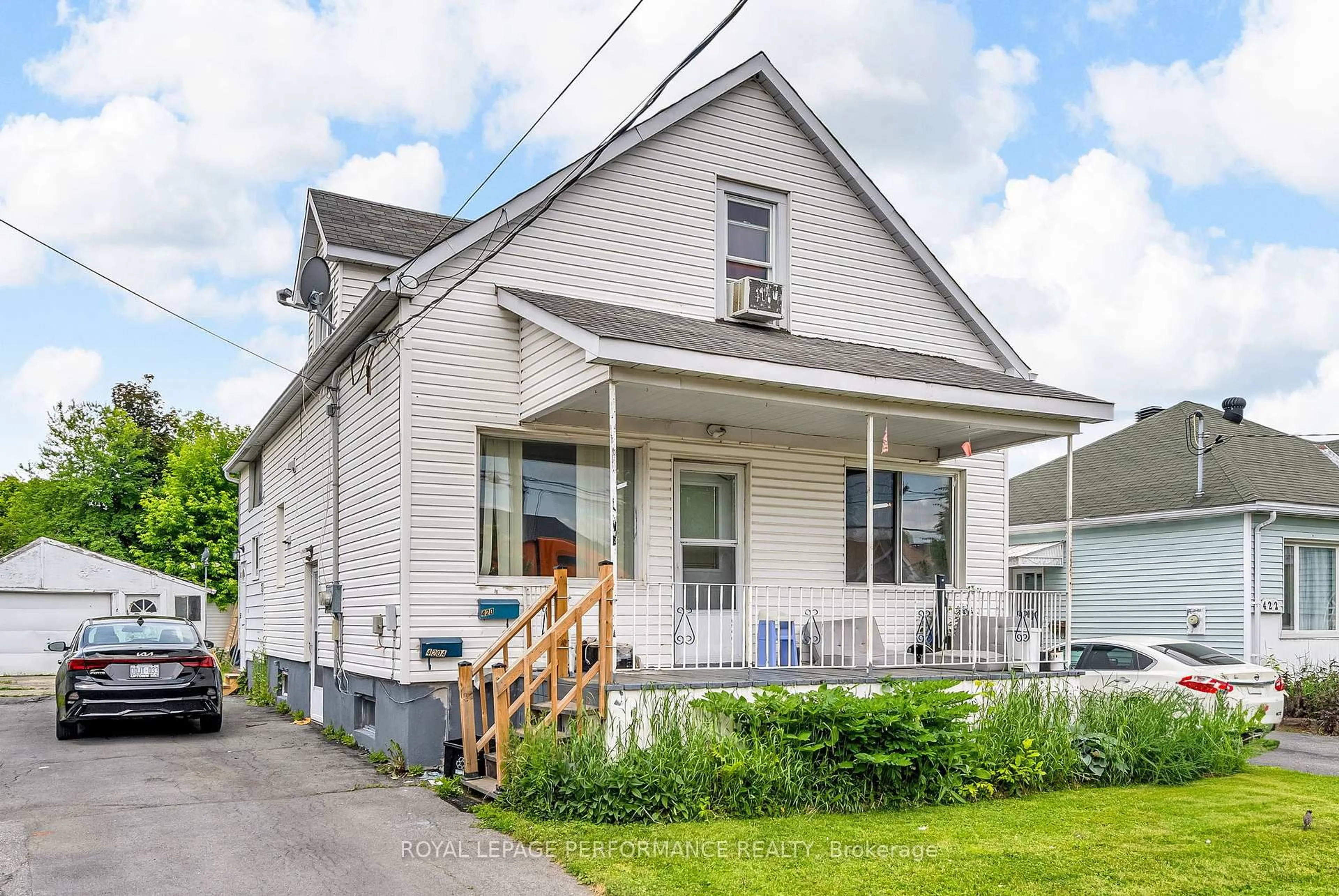 Home with vinyl exterior material, street for 420 Carleton St, Cornwall Ontario K6H 4X8