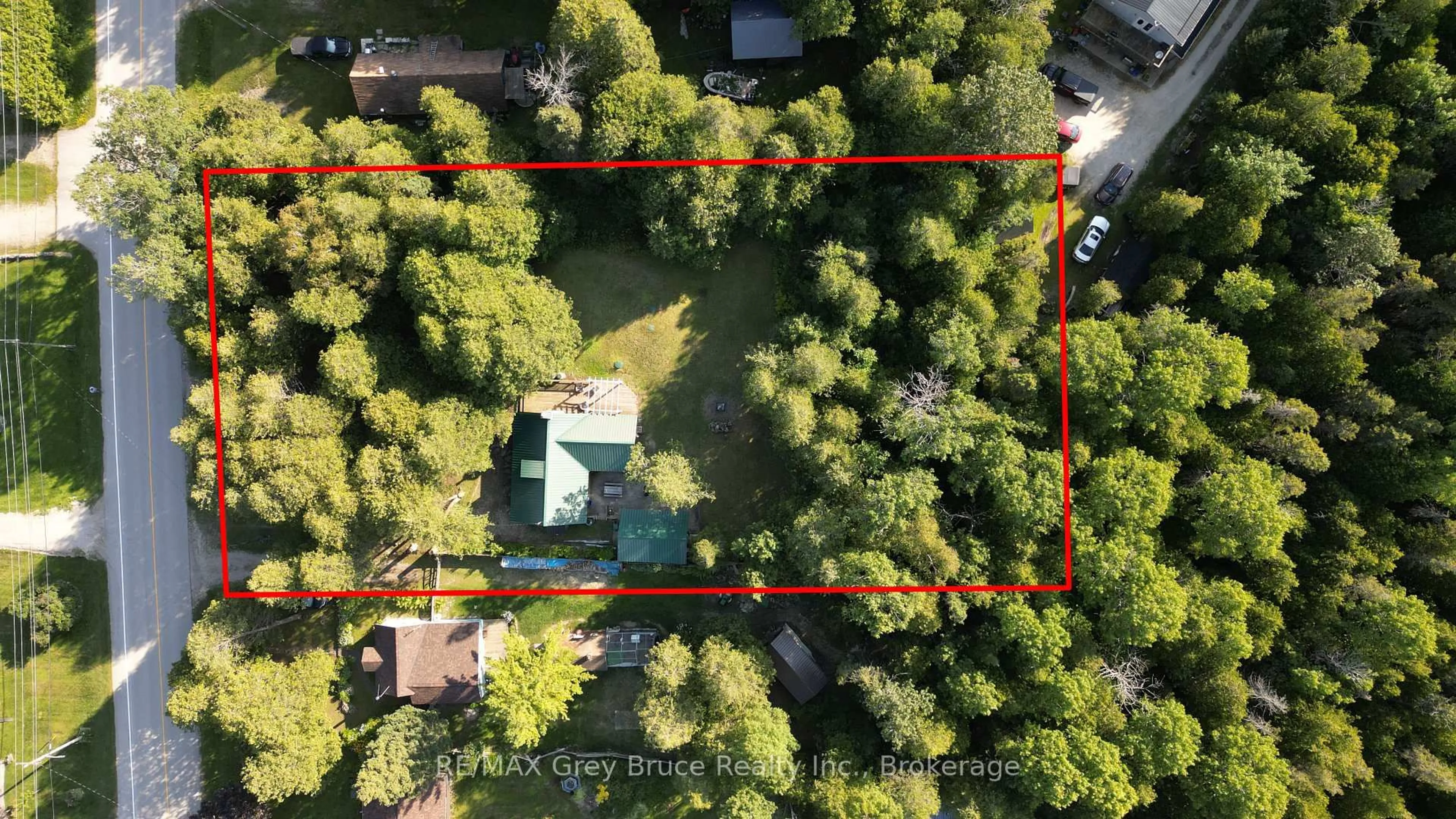 A pic from outside/outdoor area/front of a property/back of a property/a pic from drone, forest/trees view for 18 Stokes River Rd, Northern Bruce Peninsula Ontario N0H 2M0