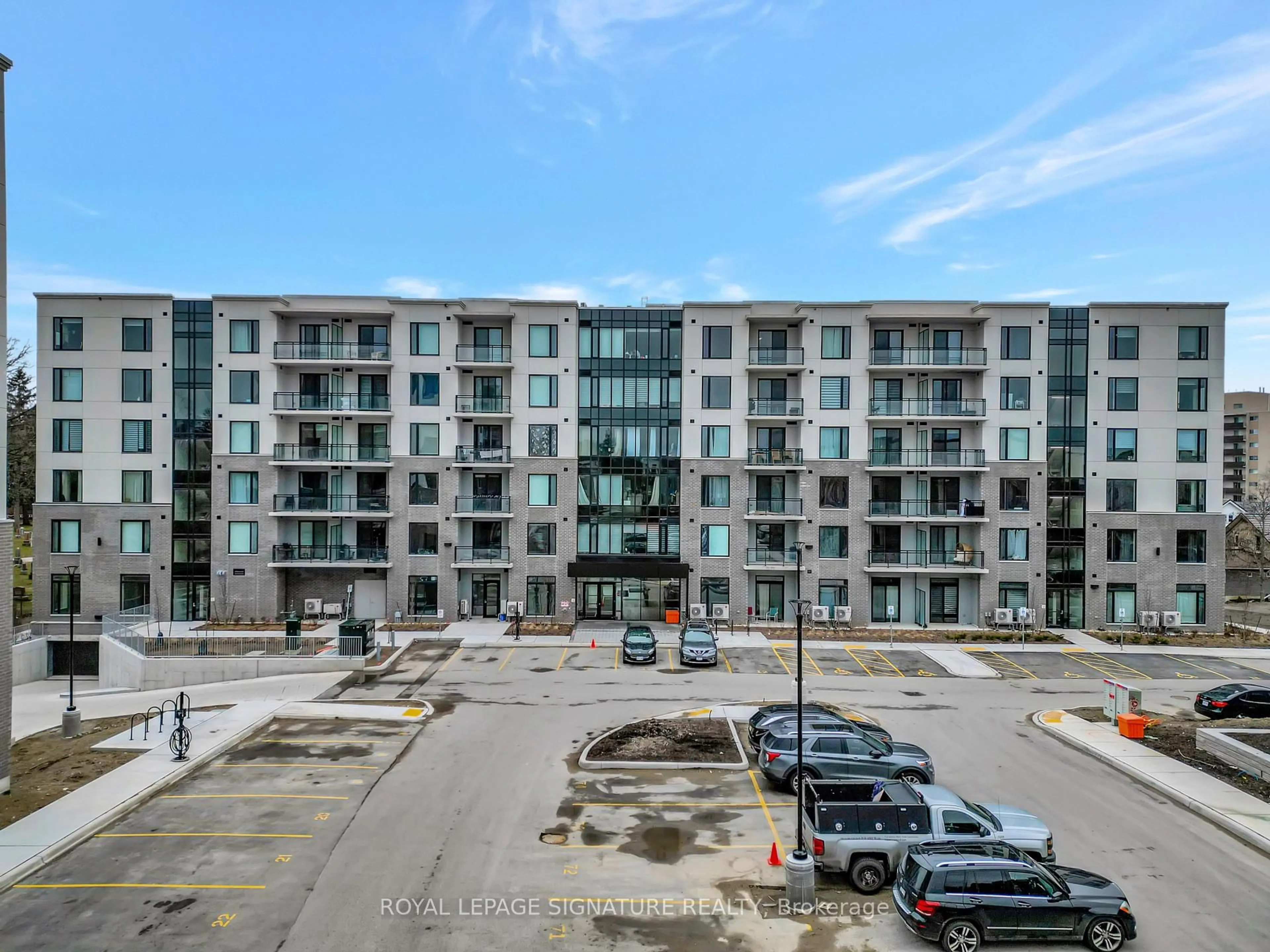 A pic from outside/outdoor area/front of a property/back of a property/a pic from drone, unknown for 103 Roger St #210, Waterloo Ontario N2J 0G2