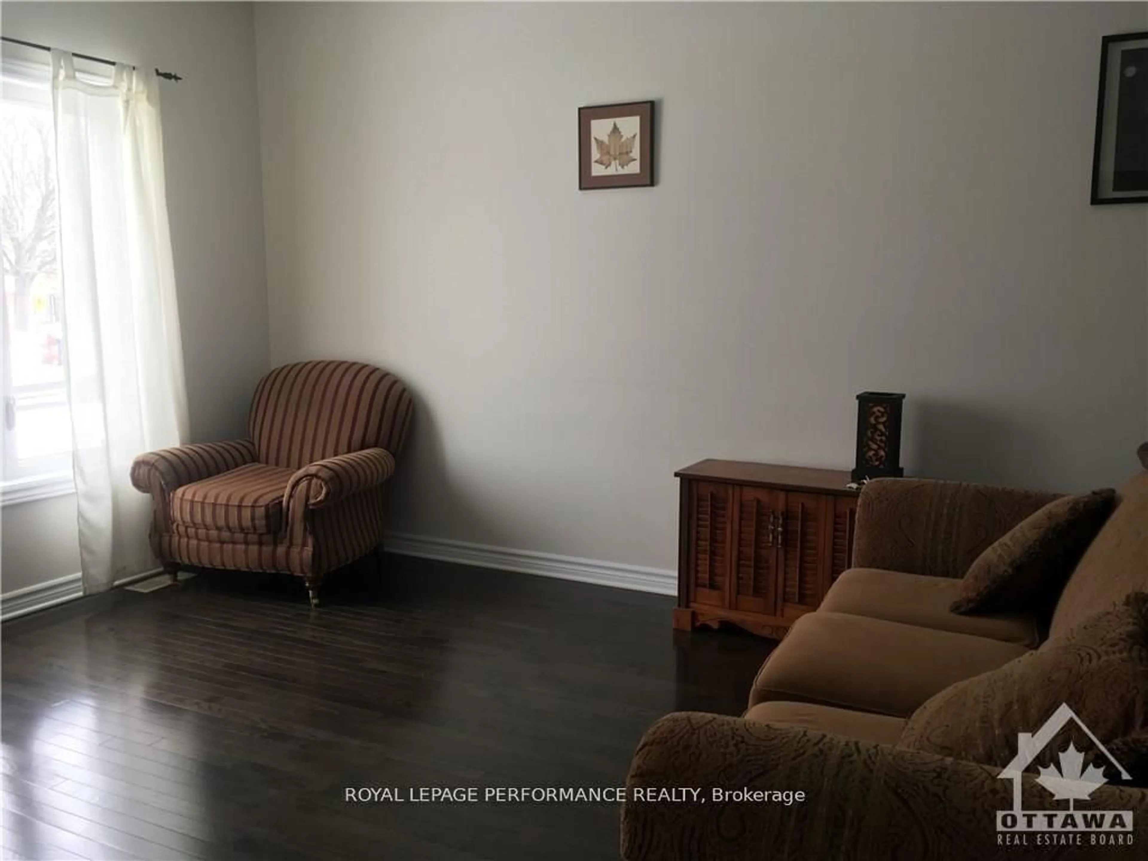 Living room with furniture, wood/laminate floor for 8164 JEANNE D'ARC Blvd, Ottawa Ontario K1E 2H5