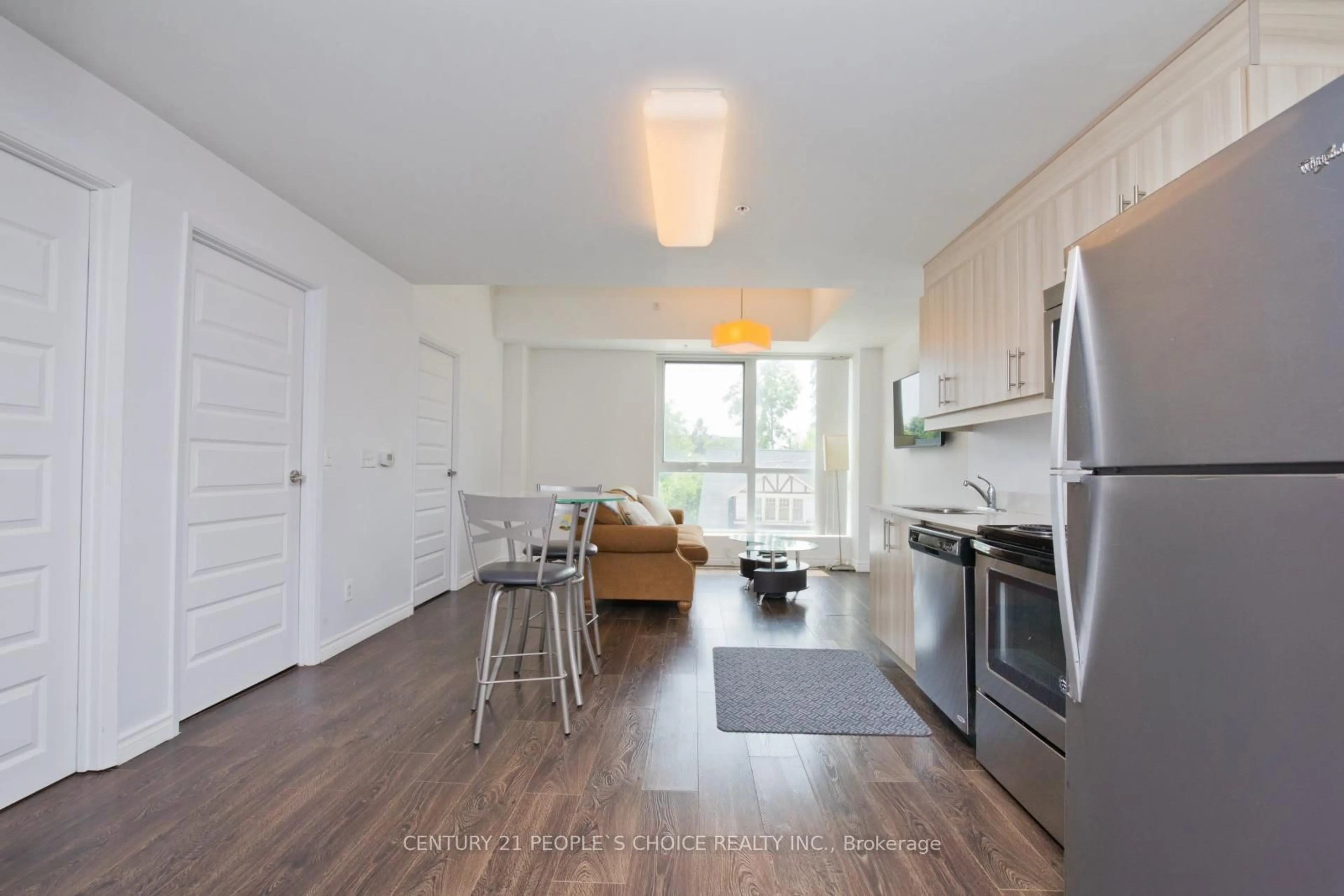 Open concept kitchen, wood/laminate floor for 160 King St #202, Waterloo Ontario N2J 0E5