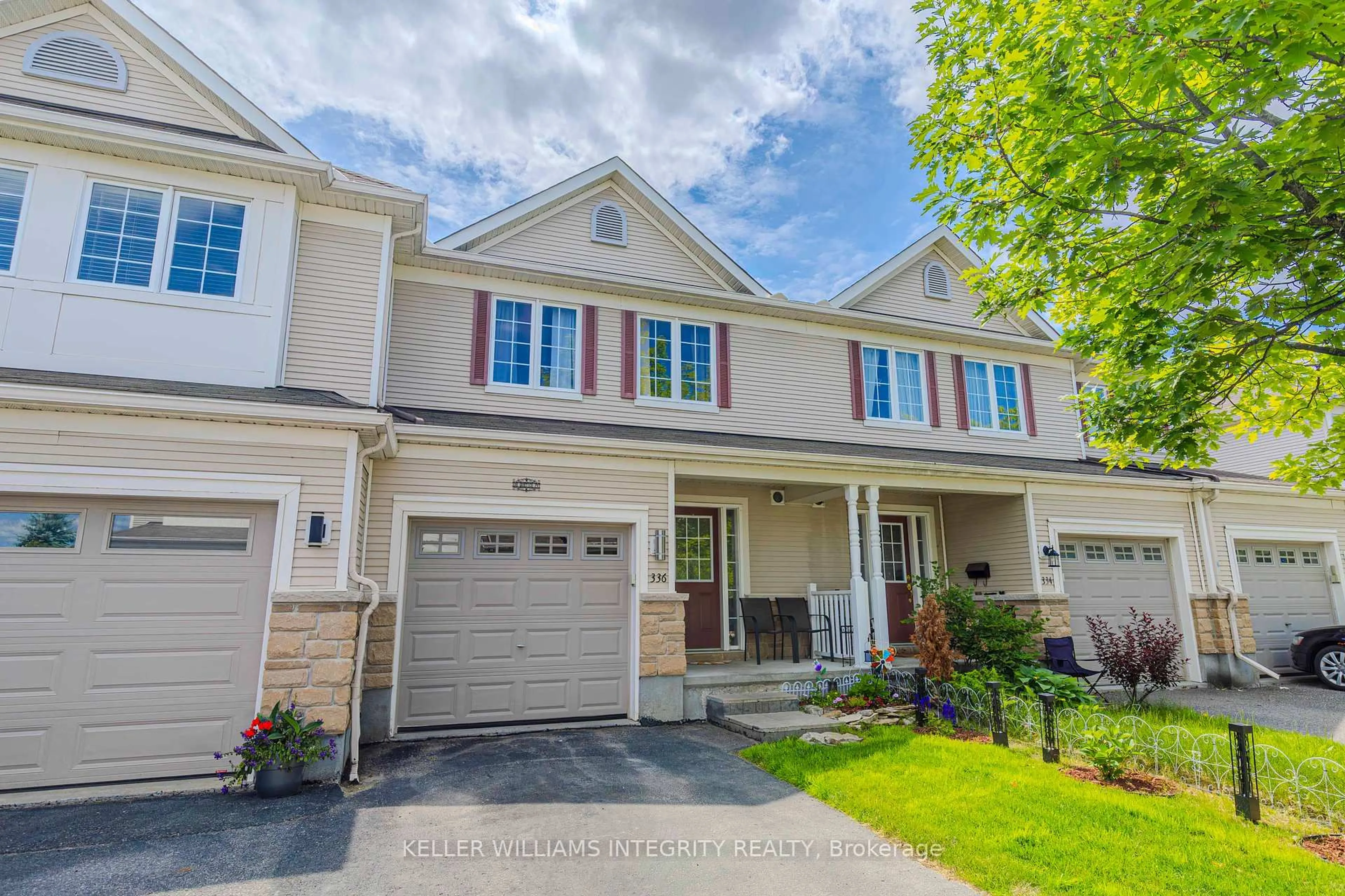 Home with vinyl exterior material, street for 336 Quetico Private, Ottawa Ontario K2J 0E5