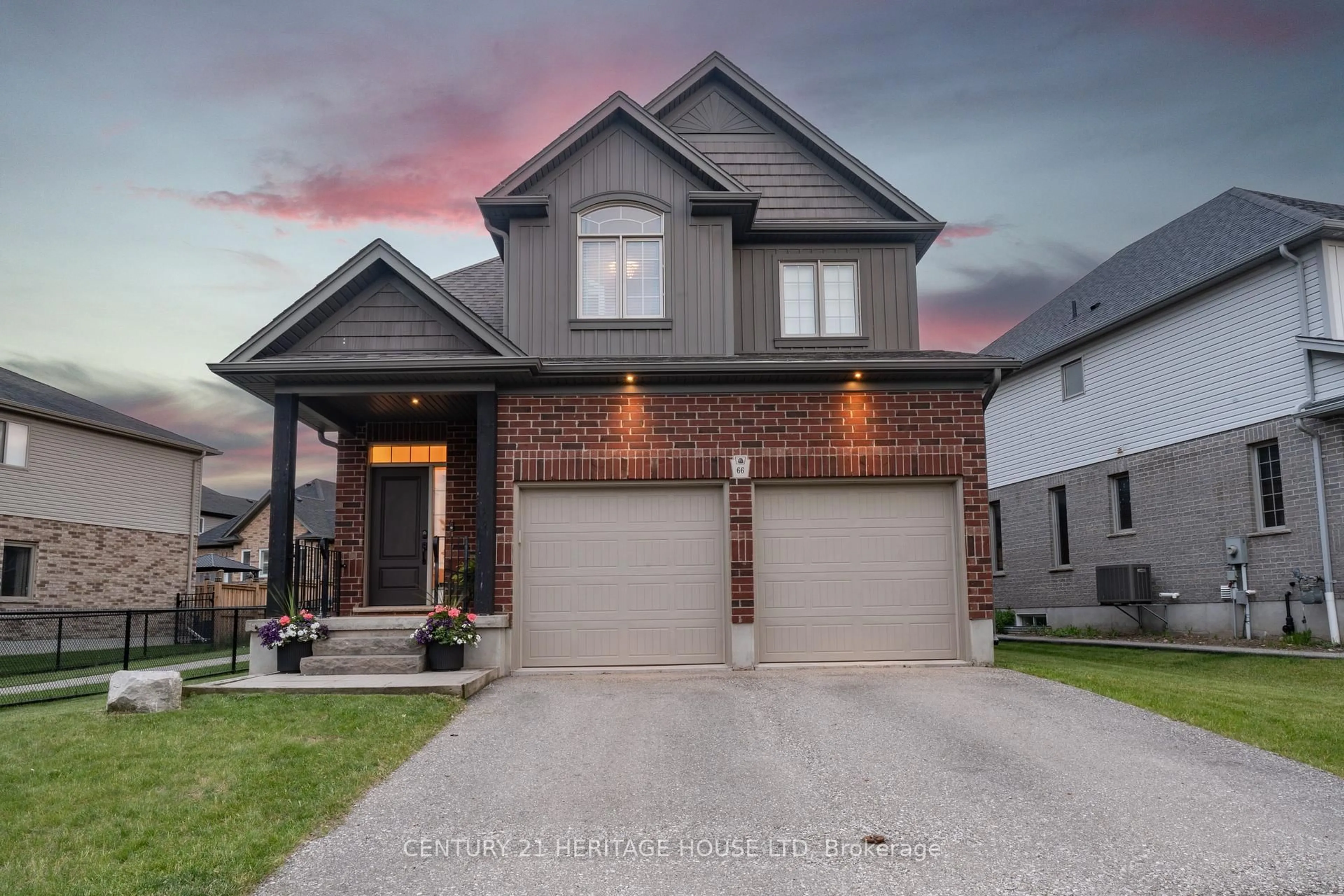 Home with brick exterior material, street for 66 Eden Oak Tr, Kitchener Ontario N2A 0G4