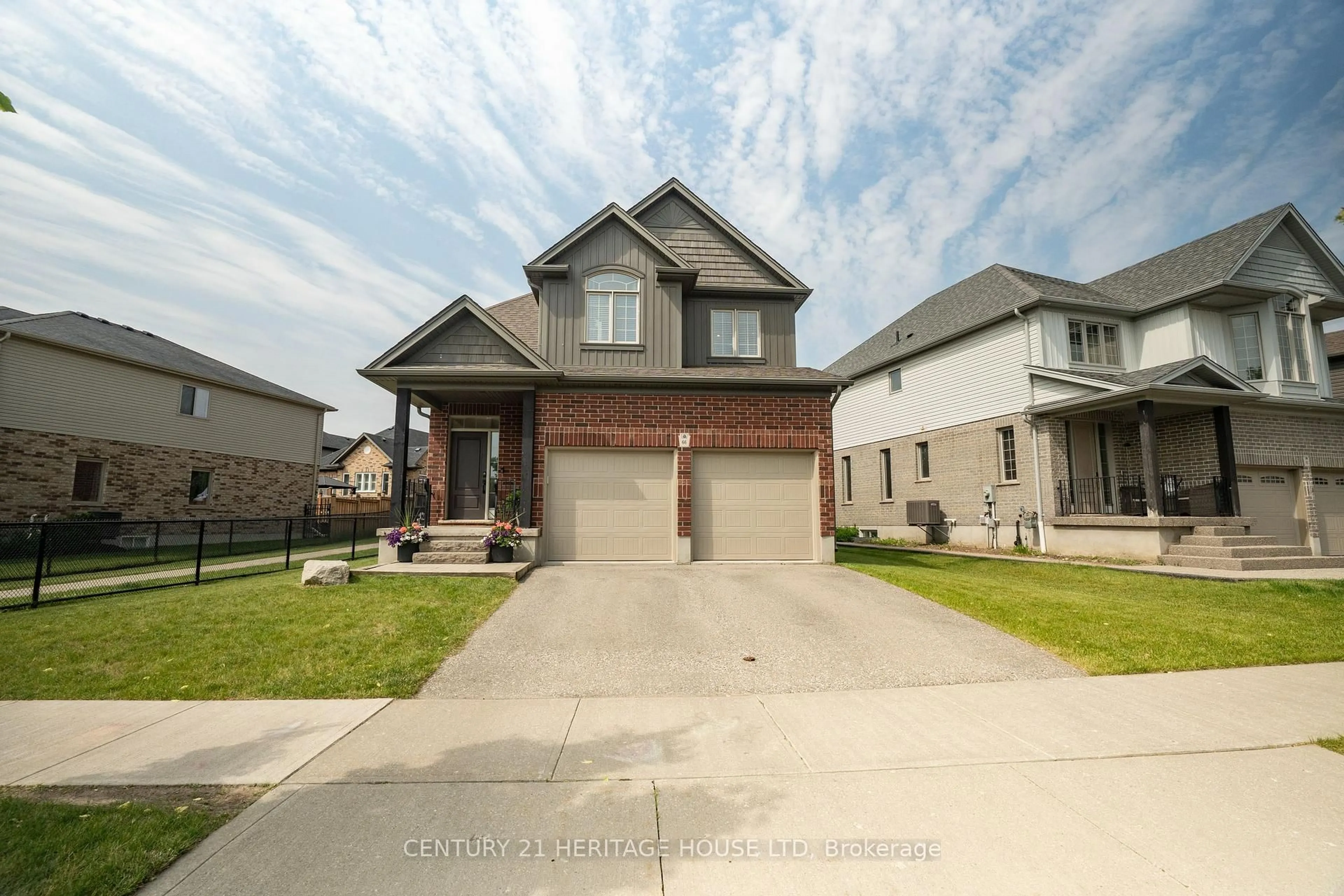 Home with brick exterior material, street for 66 Eden Oak Tr, Kitchener Ontario N2A 0G4