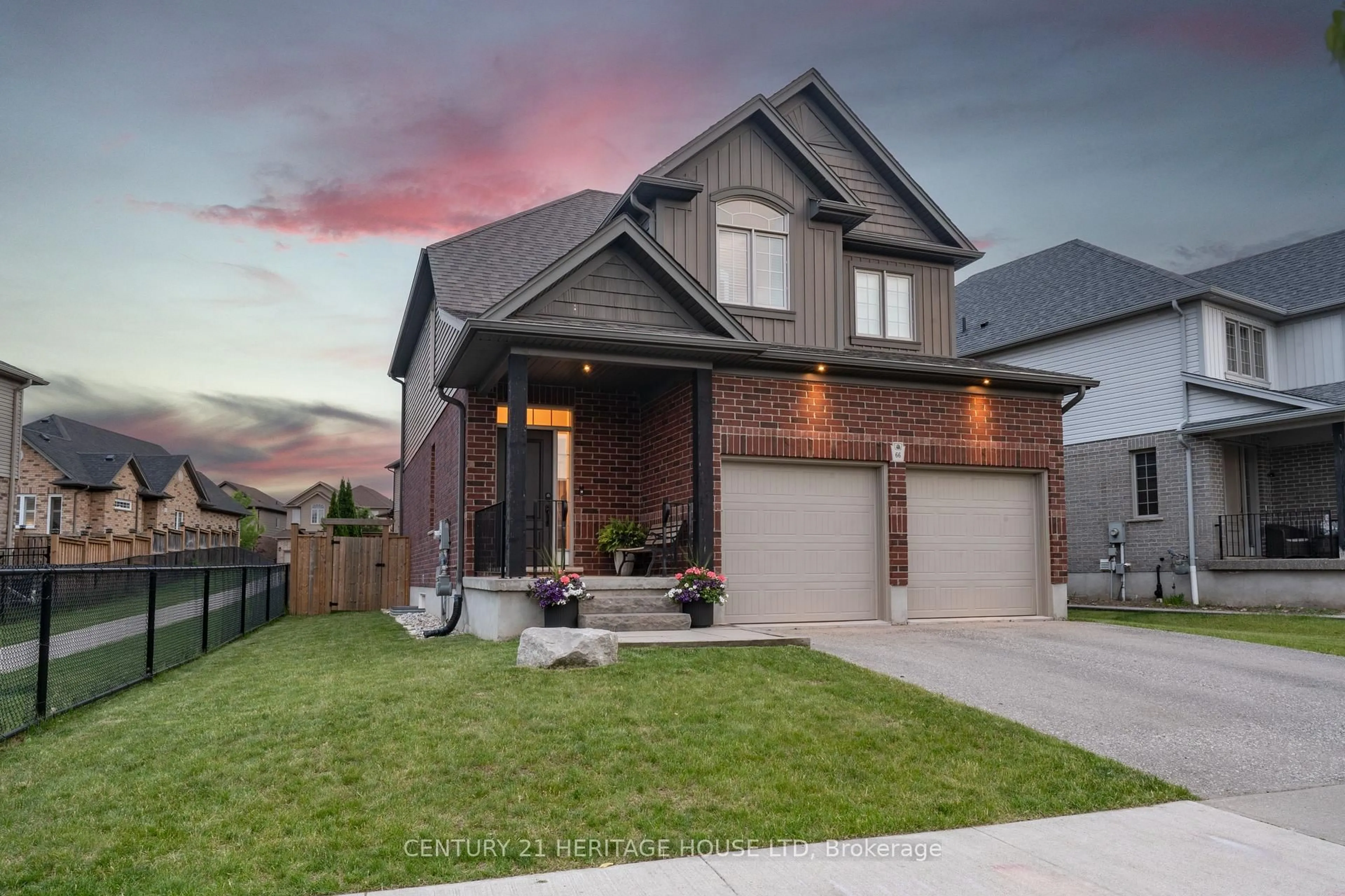 Home with brick exterior material, street for 66 Eden Oak Tr, Kitchener Ontario N2A 0G4