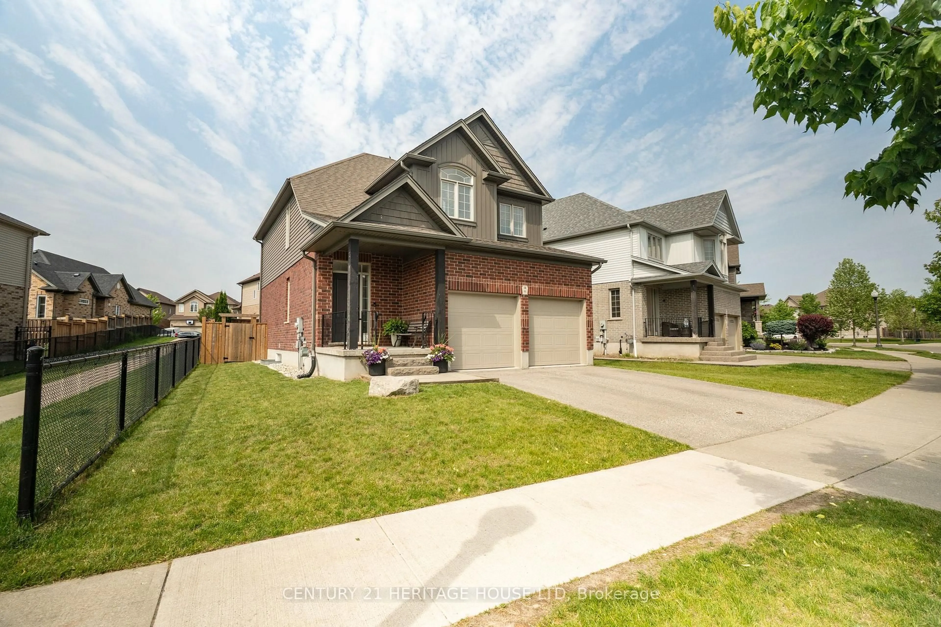 Home with brick exterior material, street for 66 Eden Oak Tr, Kitchener Ontario N2A 0G4