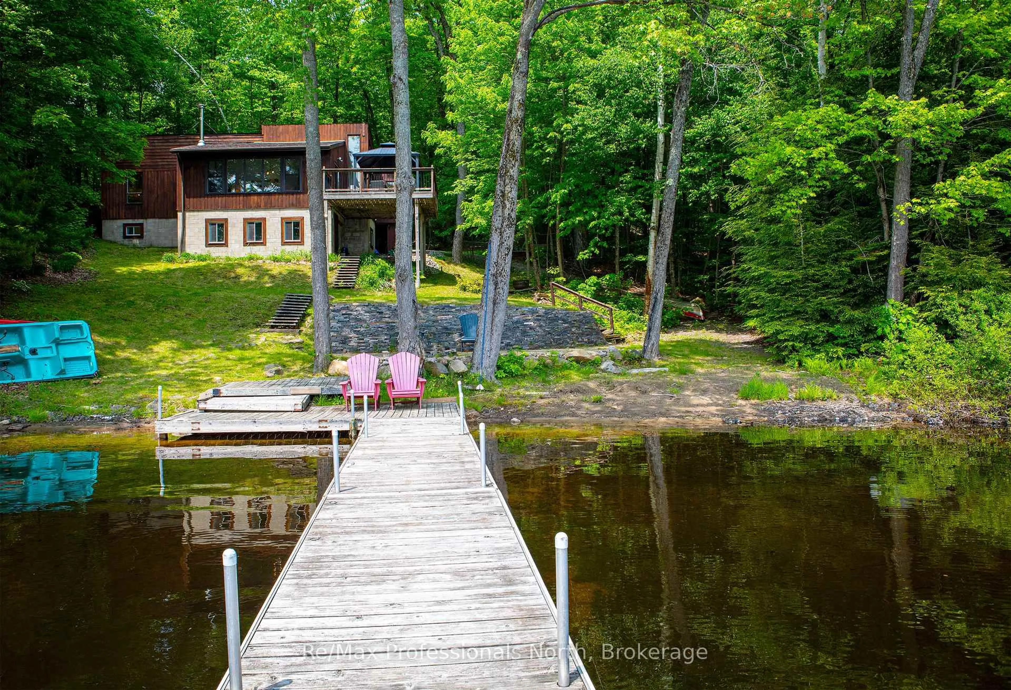 A pic from outside/outdoor area/front of a property/back of a property/a pic from drone, water/lake/river/ocean view for 1008 Seven Dwarfs Cres, Bracebridge Ontario P1L 1X1