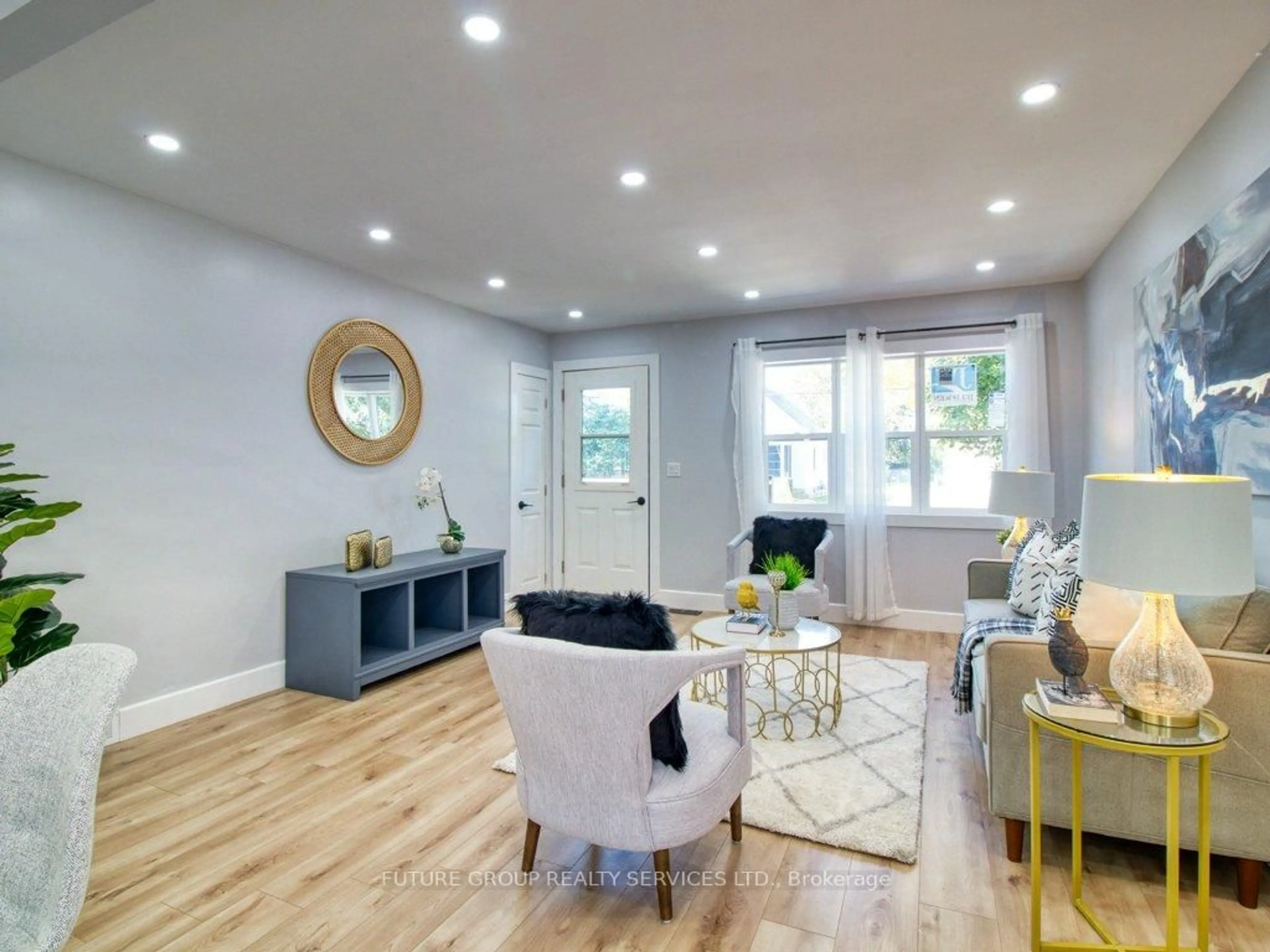 Living room with furniture, wood/laminate floor for 47 Forhan St, Chatham-Kent Ontario N8A 3Z2