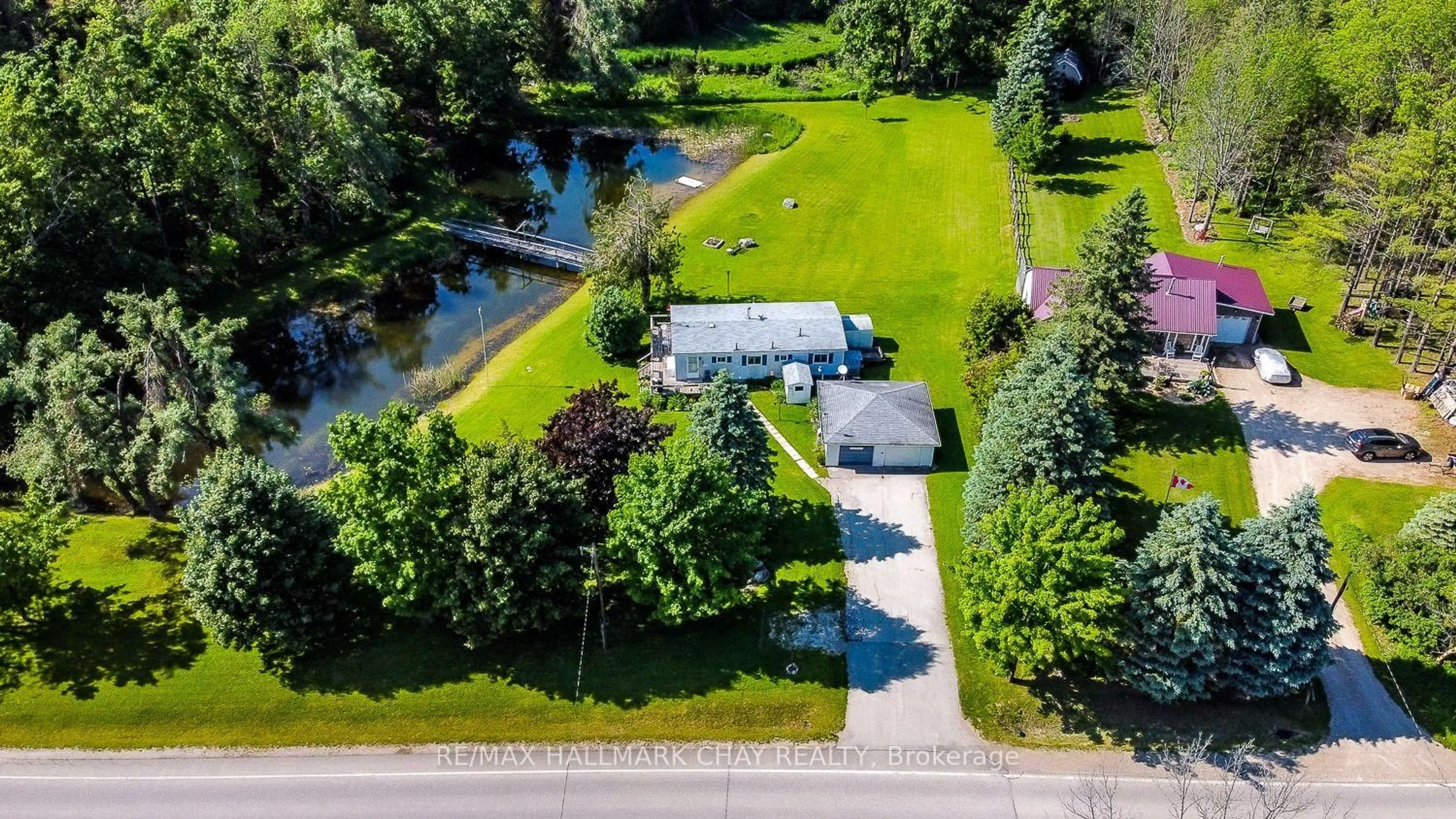 A pic from outside/outdoor area/front of a property/back of a property/a pic from drone, water/lake/river/ocean view for 707063 County Road 21, Mulmur Ontario L0N 1S7
