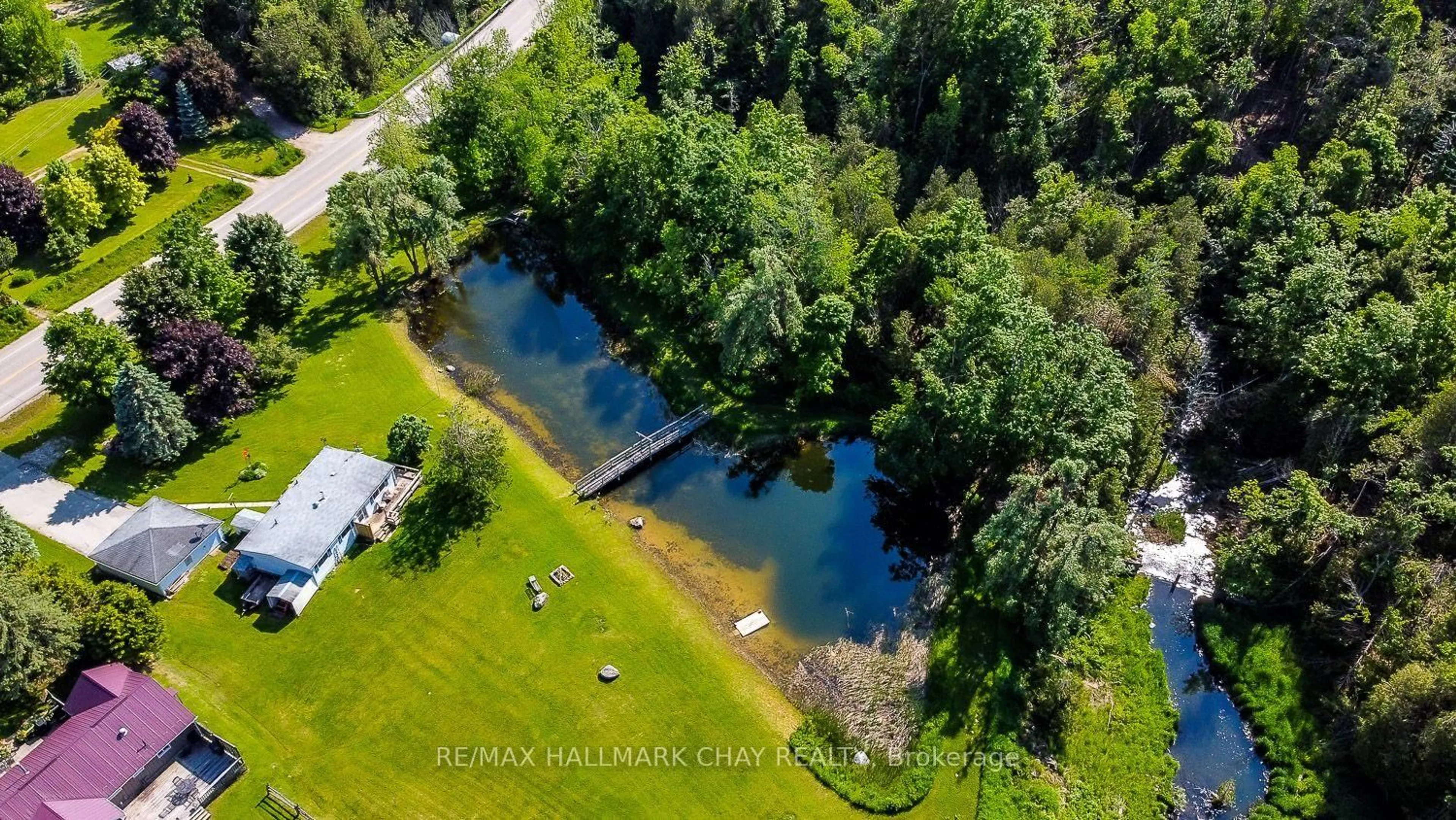 A pic from outside/outdoor area/front of a property/back of a property/a pic from drone, water/lake/river/ocean view for 707063 County Road 21, Mulmur Ontario L0N 1S7