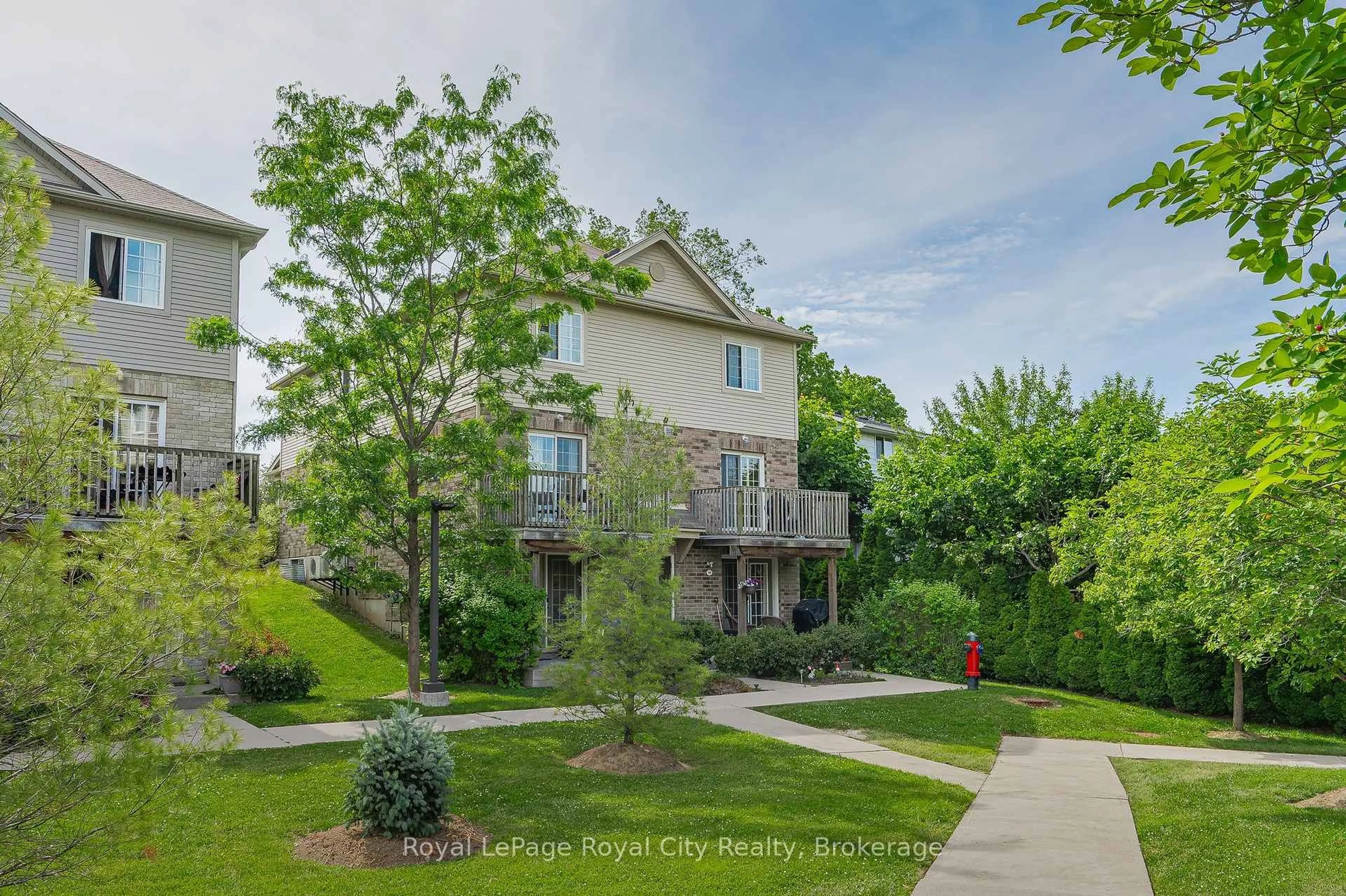 A pic from outside/outdoor area/front of a property/back of a property/a pic from drone, street for 35 Mountford Dr #14, Guelph Ontario N1E 0G6