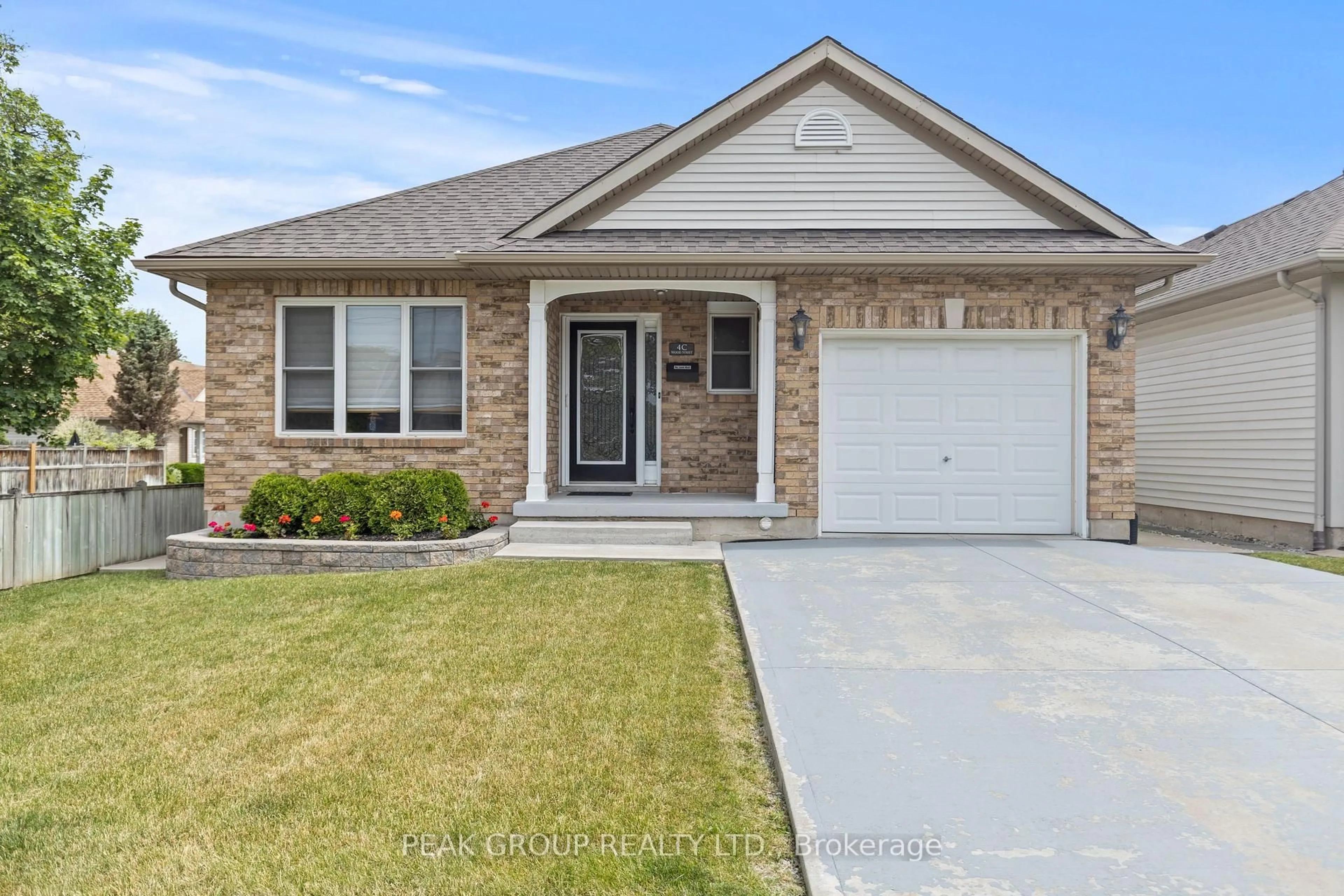 Home with vinyl exterior material, street for 4C Wood Street, St. Catharines Ontario L2N 2A9
