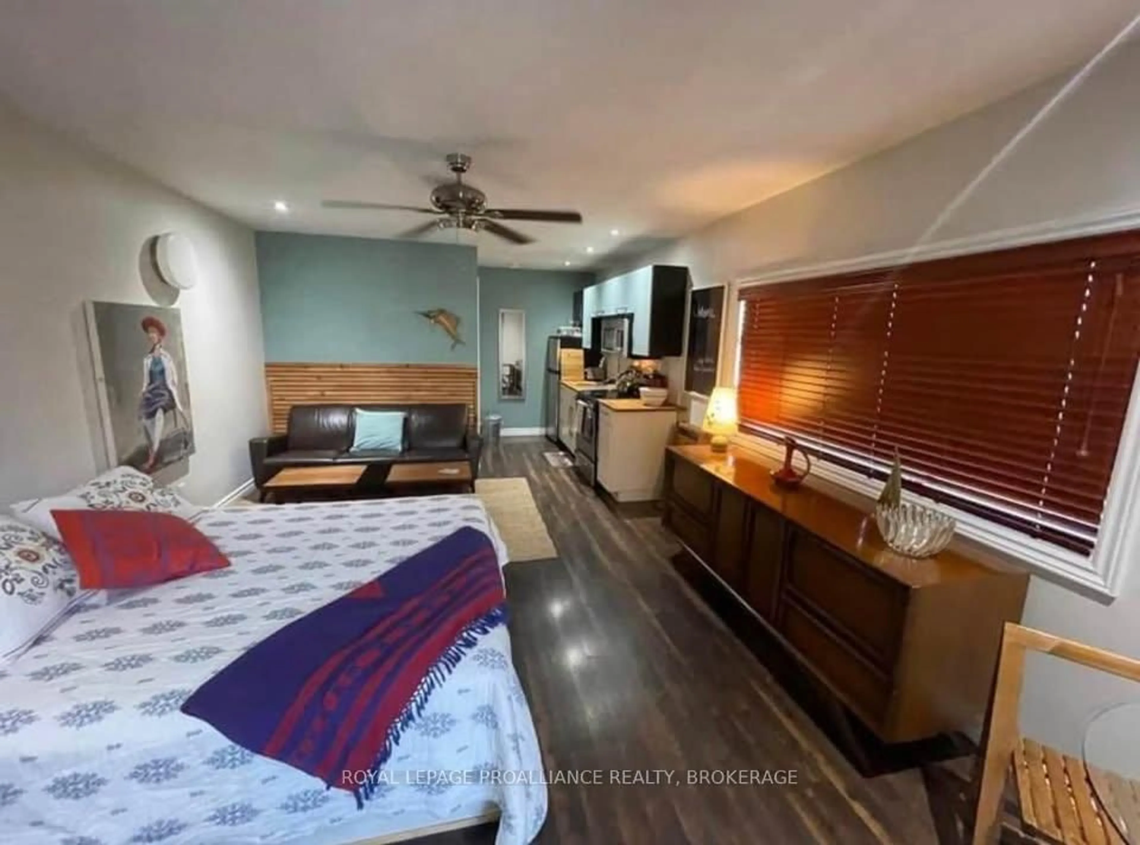Bedroom with bed, wood/laminate floor for 145 Main St, Gananoque Ontario K7G 2M1