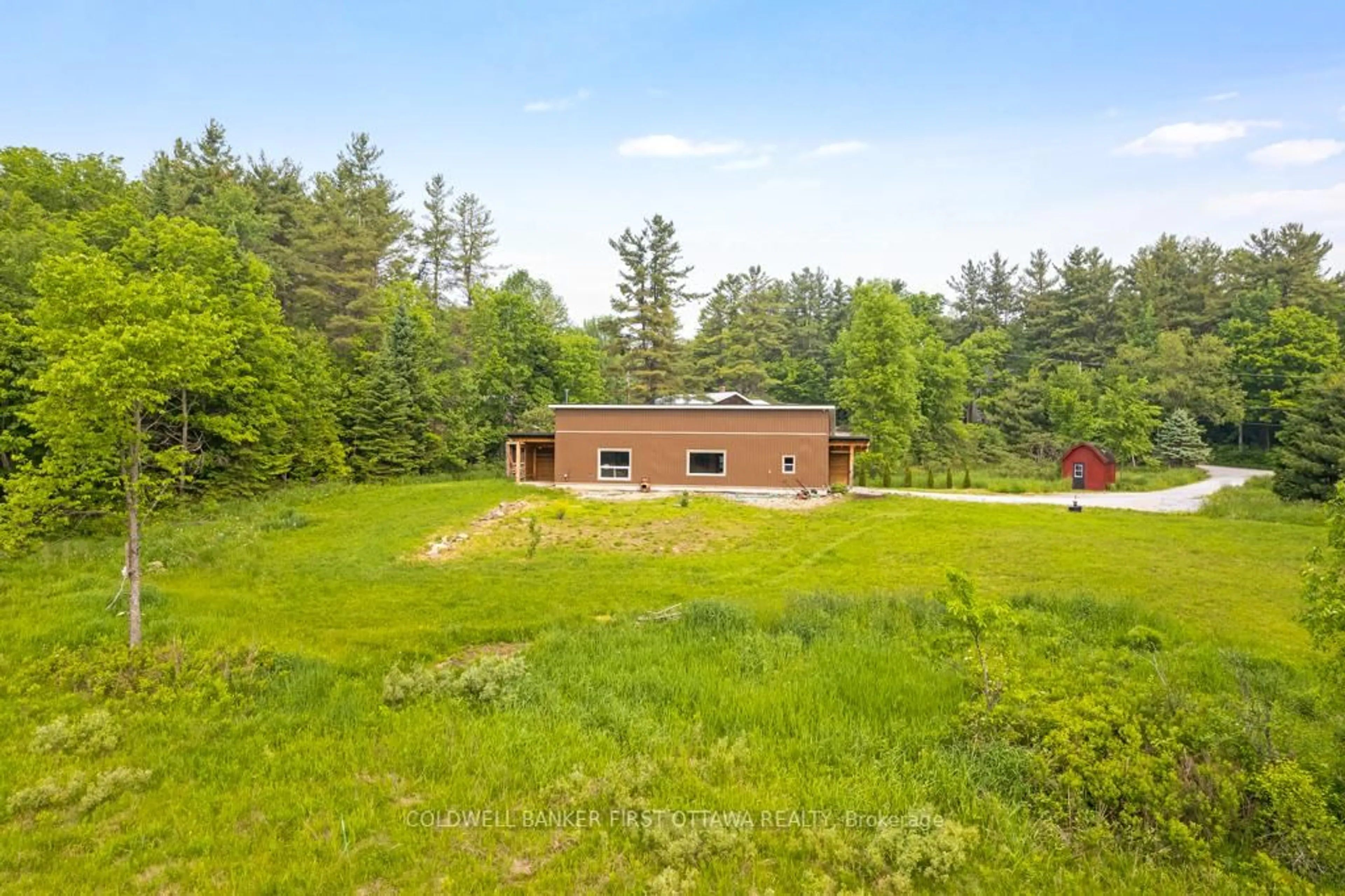 A pic from outside/outdoor area/front of a property/back of a property/a pic from drone, forest/trees view for 301 Maberly Station Rd, Maberly Ontario K0H 2B0