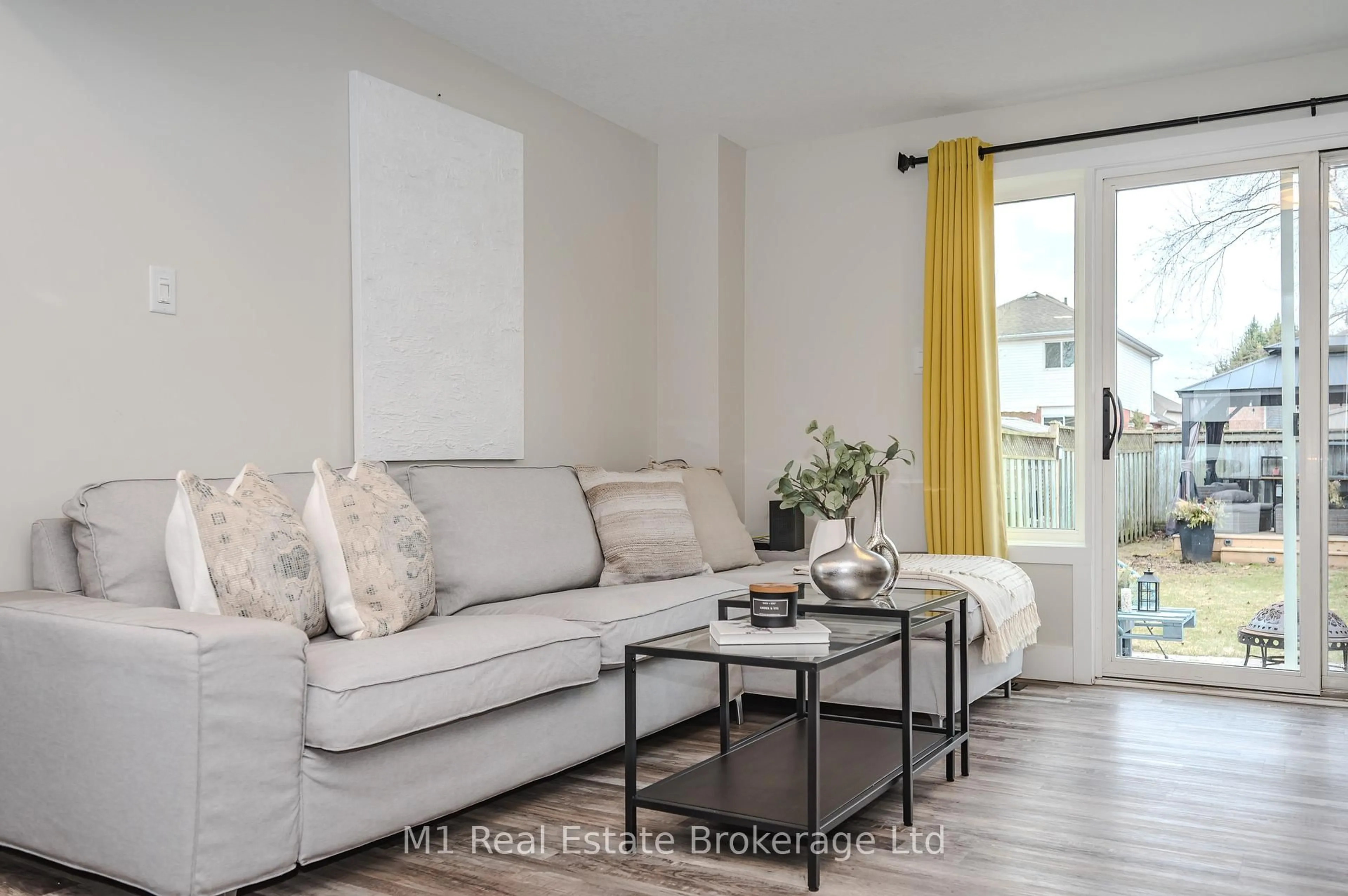 Living room with furniture, wood/laminate floor for 155 Stephanie Dr, Guelph Ontario N1K 1X7