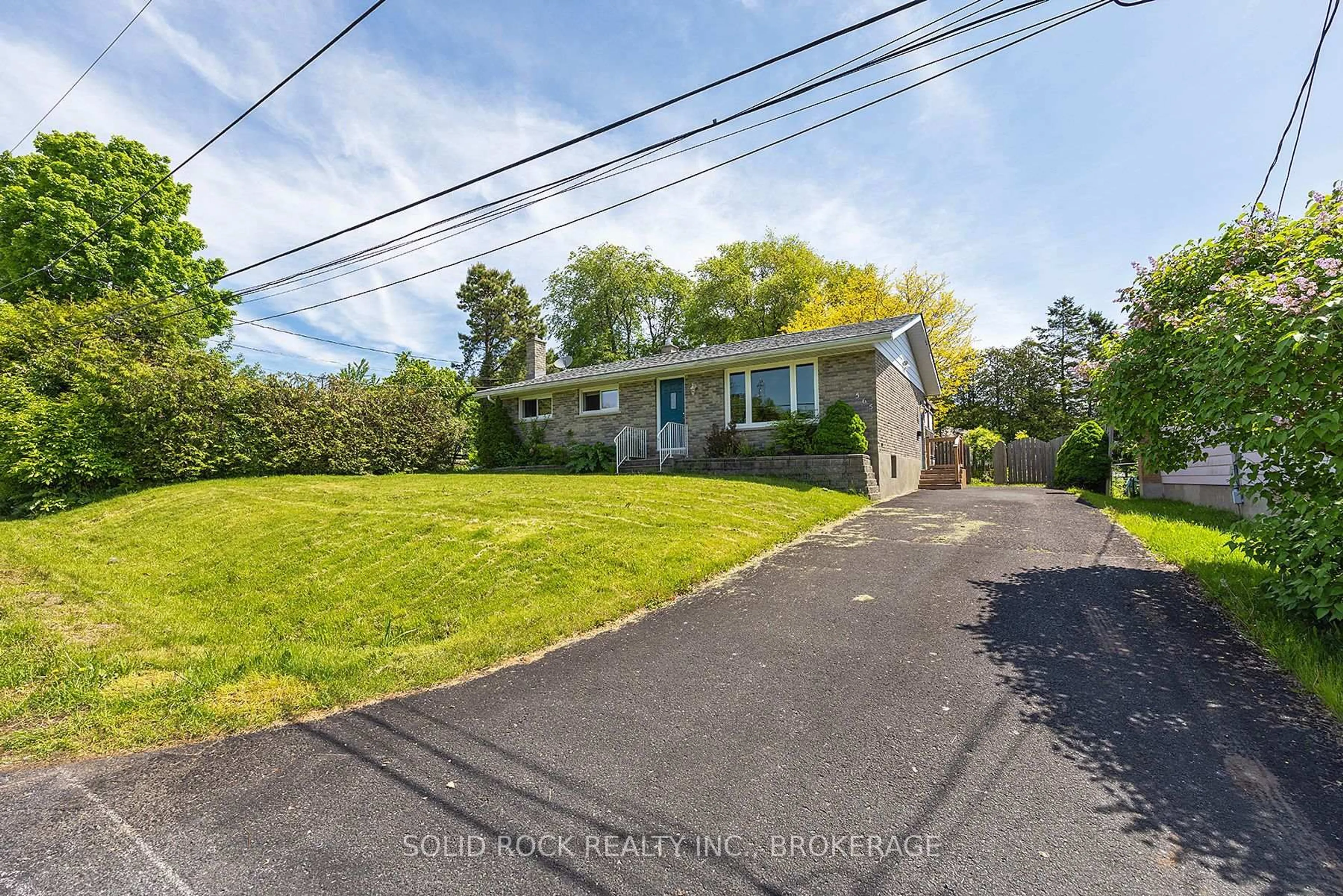 A pic from outside/outdoor area/front of a property/back of a property/a pic from drone, street for 565 Queen St, Gananoque Ontario K7G 2A9