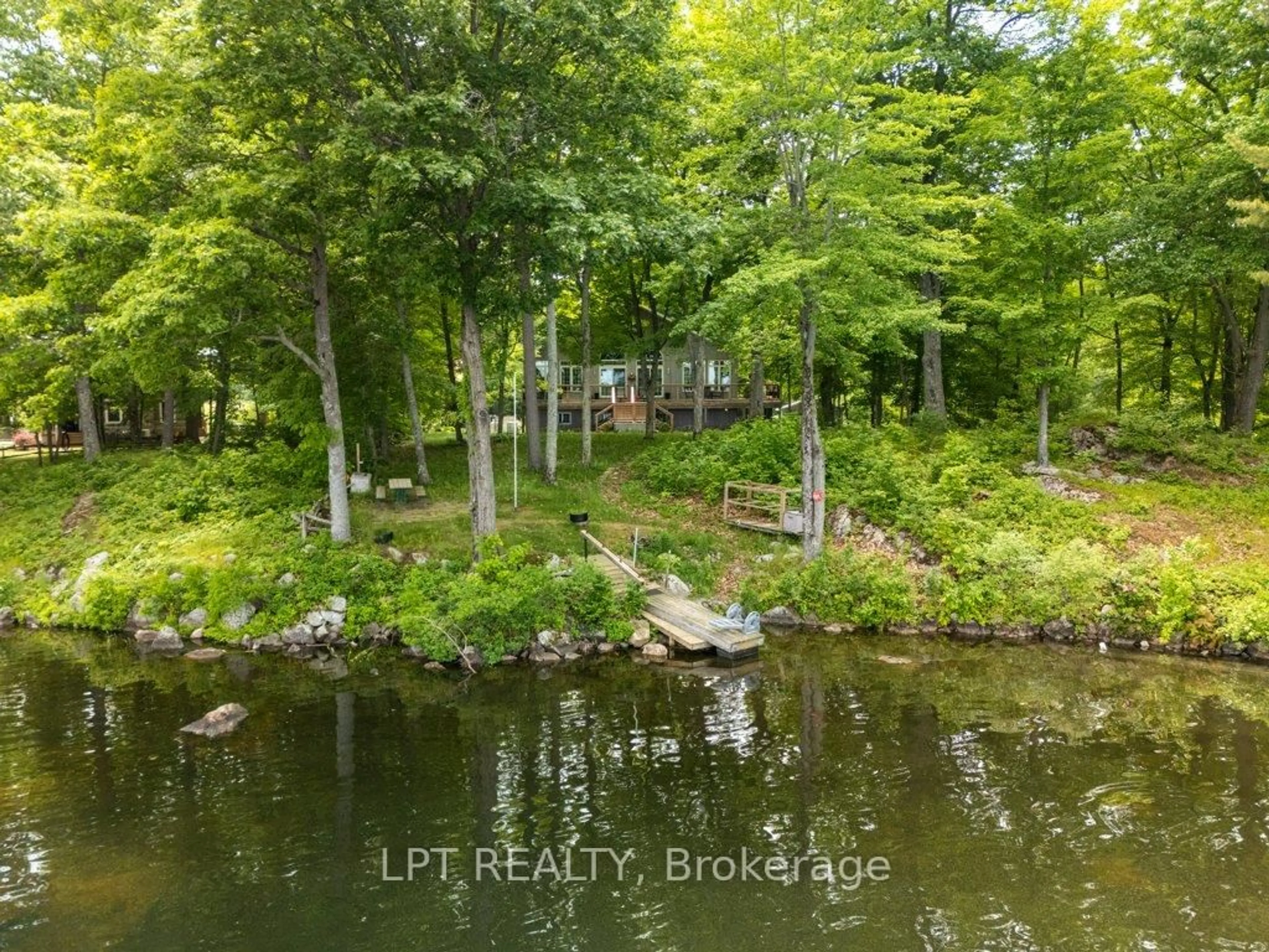 A pic from outside/outdoor area/front of a property/back of a property/a pic from drone, water/lake/river/ocean view for 1165 Dalton Lane, Godfrey Ontario K0H 1T0