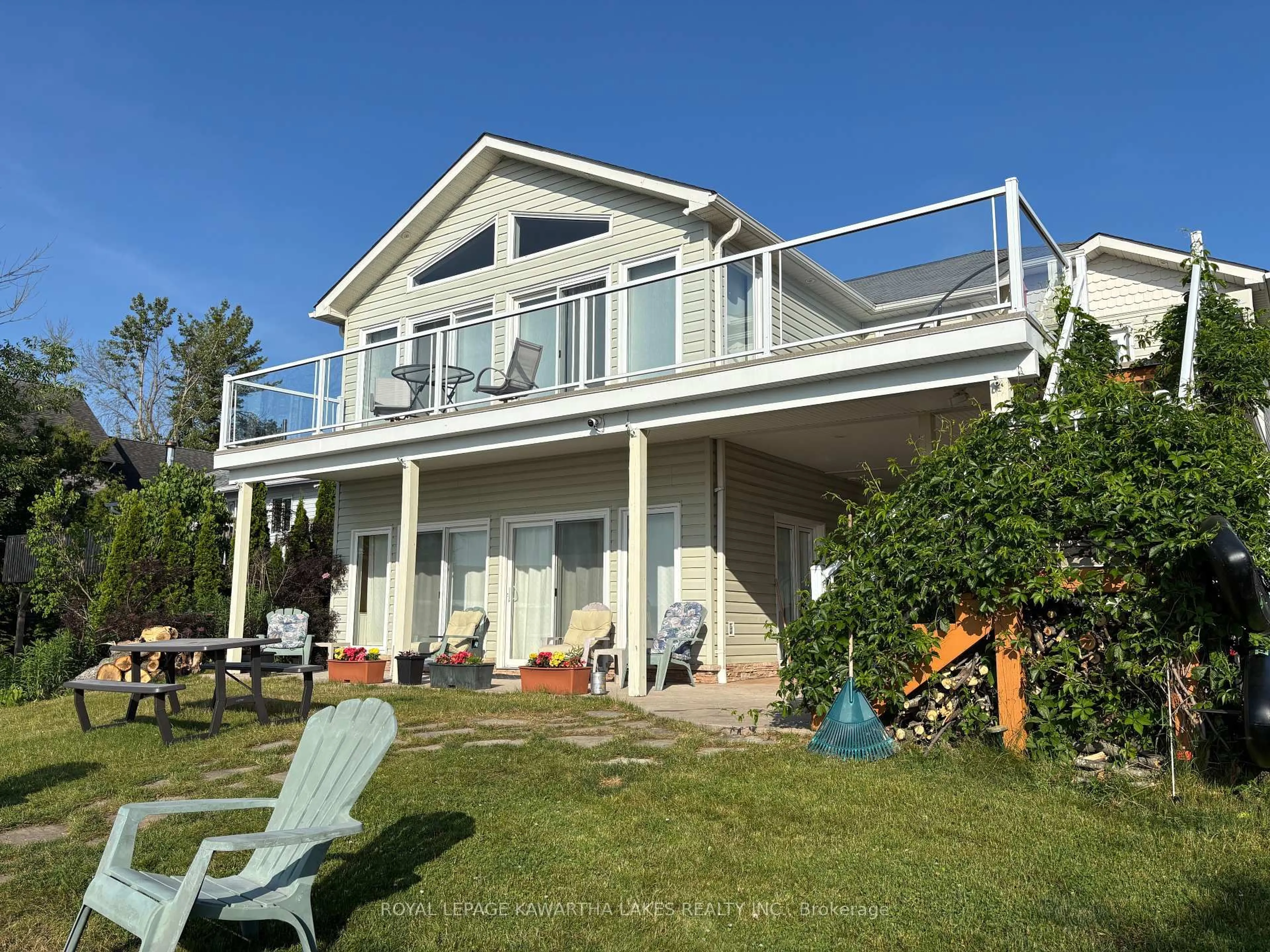 Home with vinyl exterior material, water/lake/river/ocean view for 595 Foley Rd, Otonabee-South Monaghan Ontario K0L 2G0