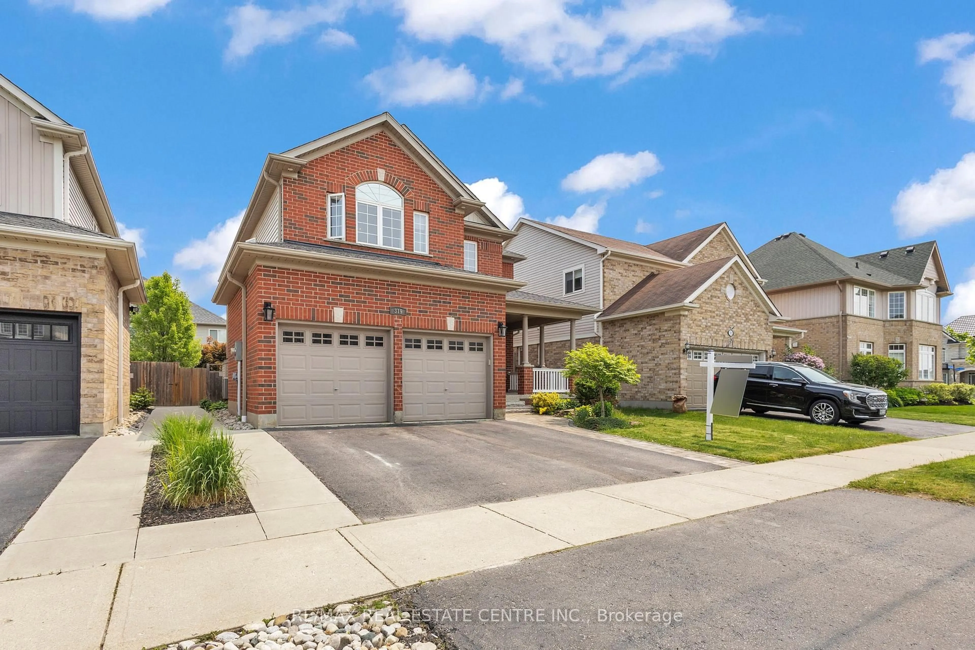 Home with brick exterior material, street for 319 Robert Ferrie Dr, Kitchener Ontario N2P 2Y7