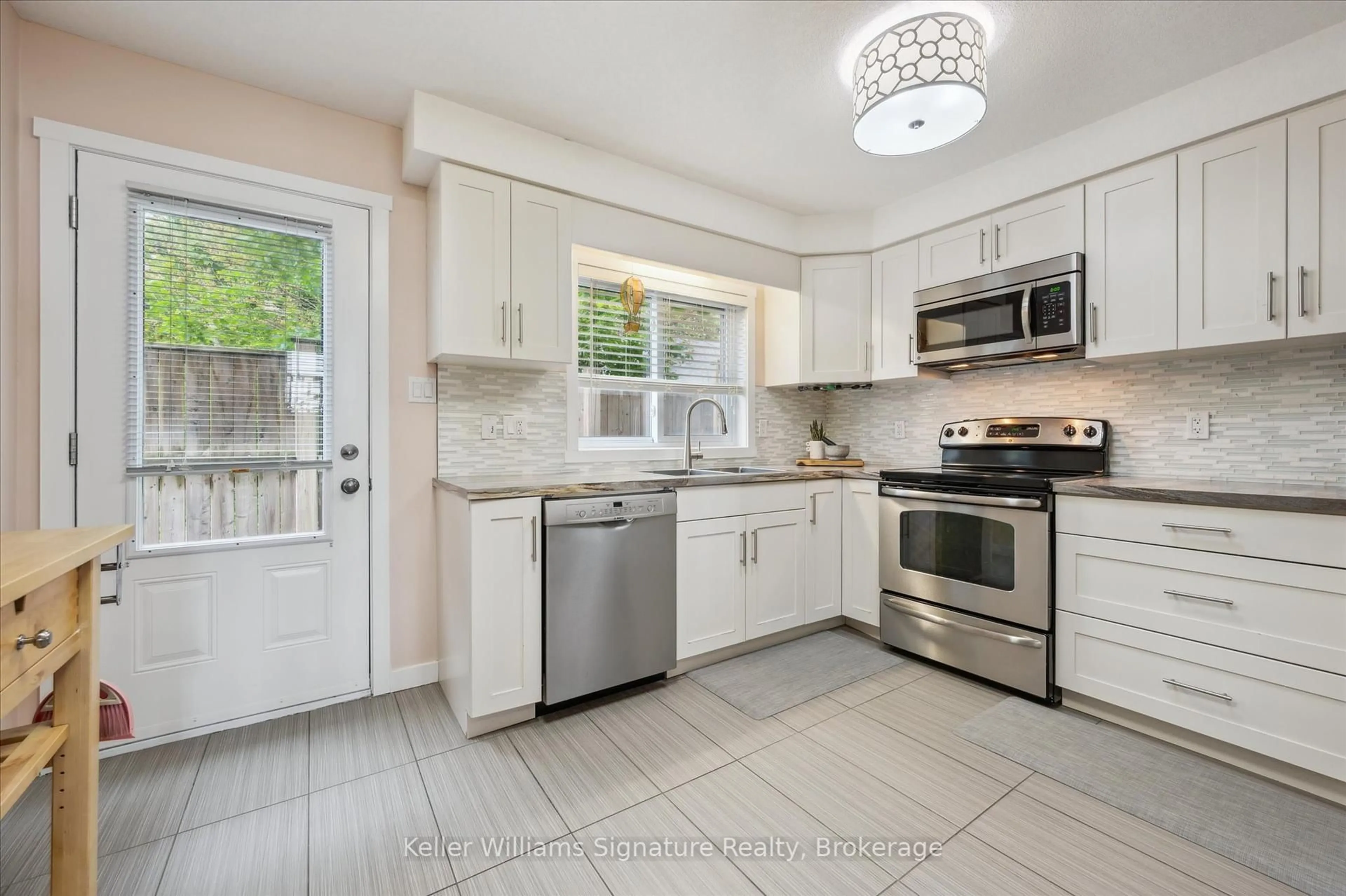 Open concept kitchen, ceramic/tile floor for 487 East Ave #2, Kitchener Ontario N2H 0A8
