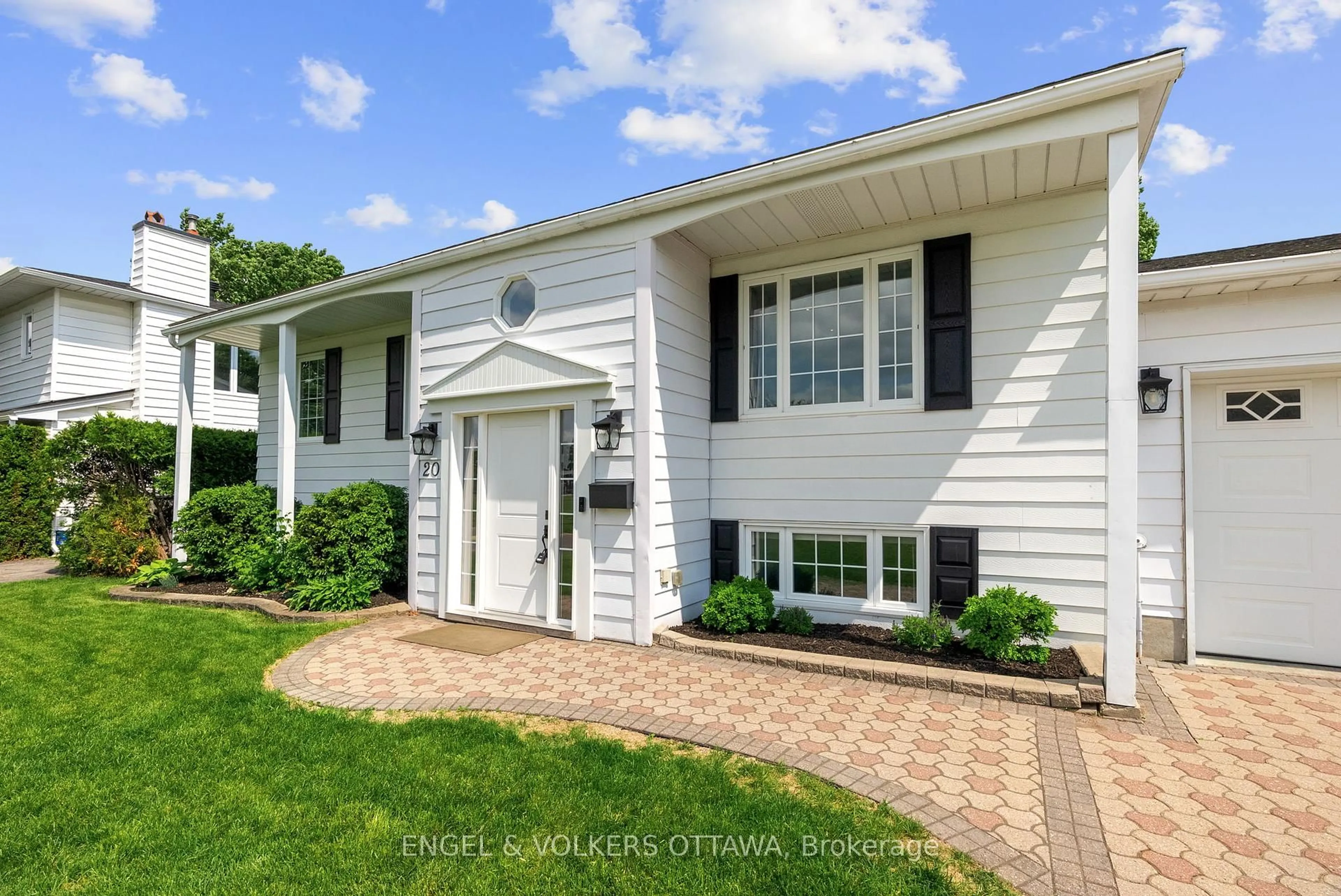 Home with vinyl exterior material, street for 20 Assiniboine Dr, Ottawa Ontario K2E 5R7