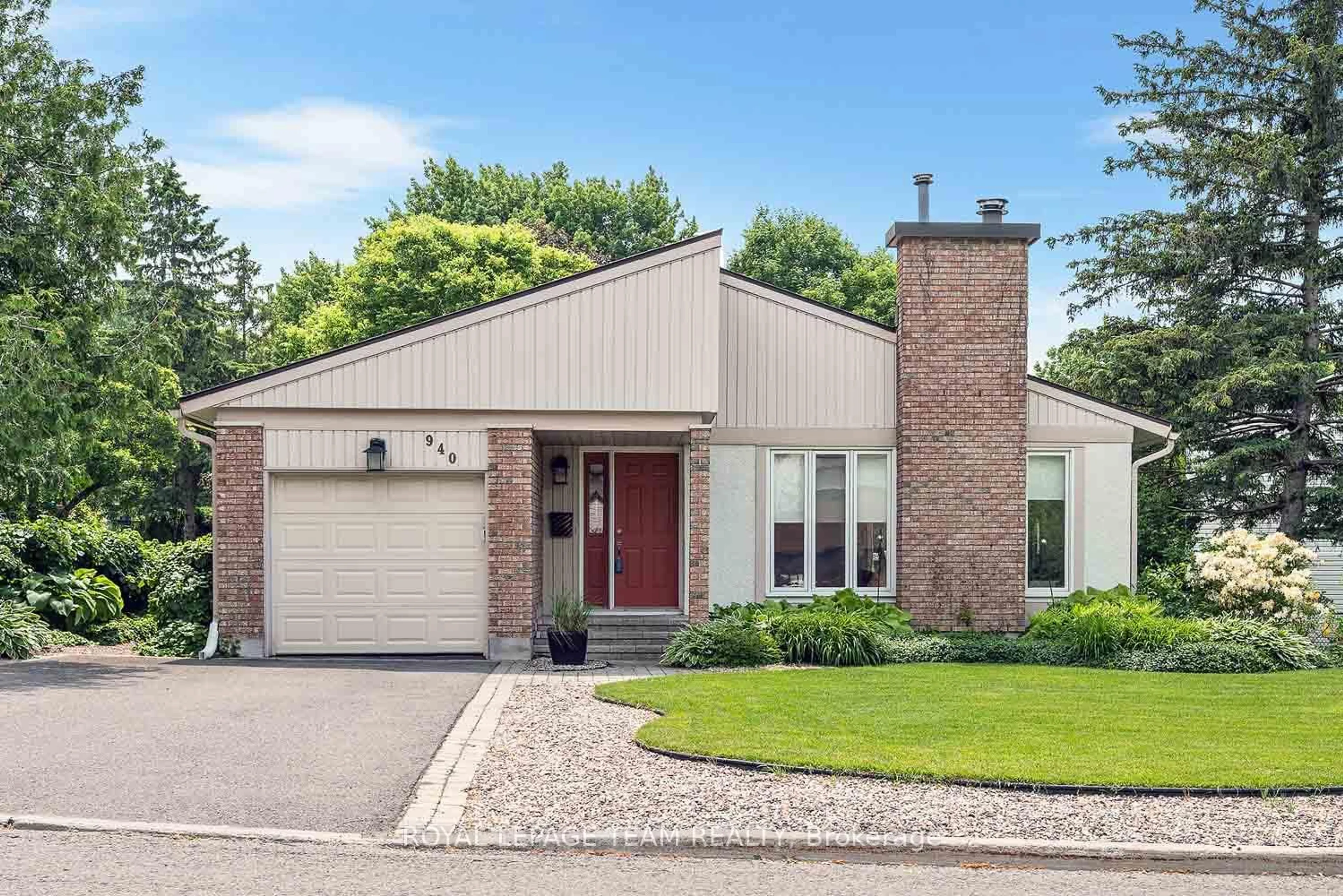 Home with brick exterior material, street for 940 Beauclaire Dr, Ottawa Ontario K1C 2J3