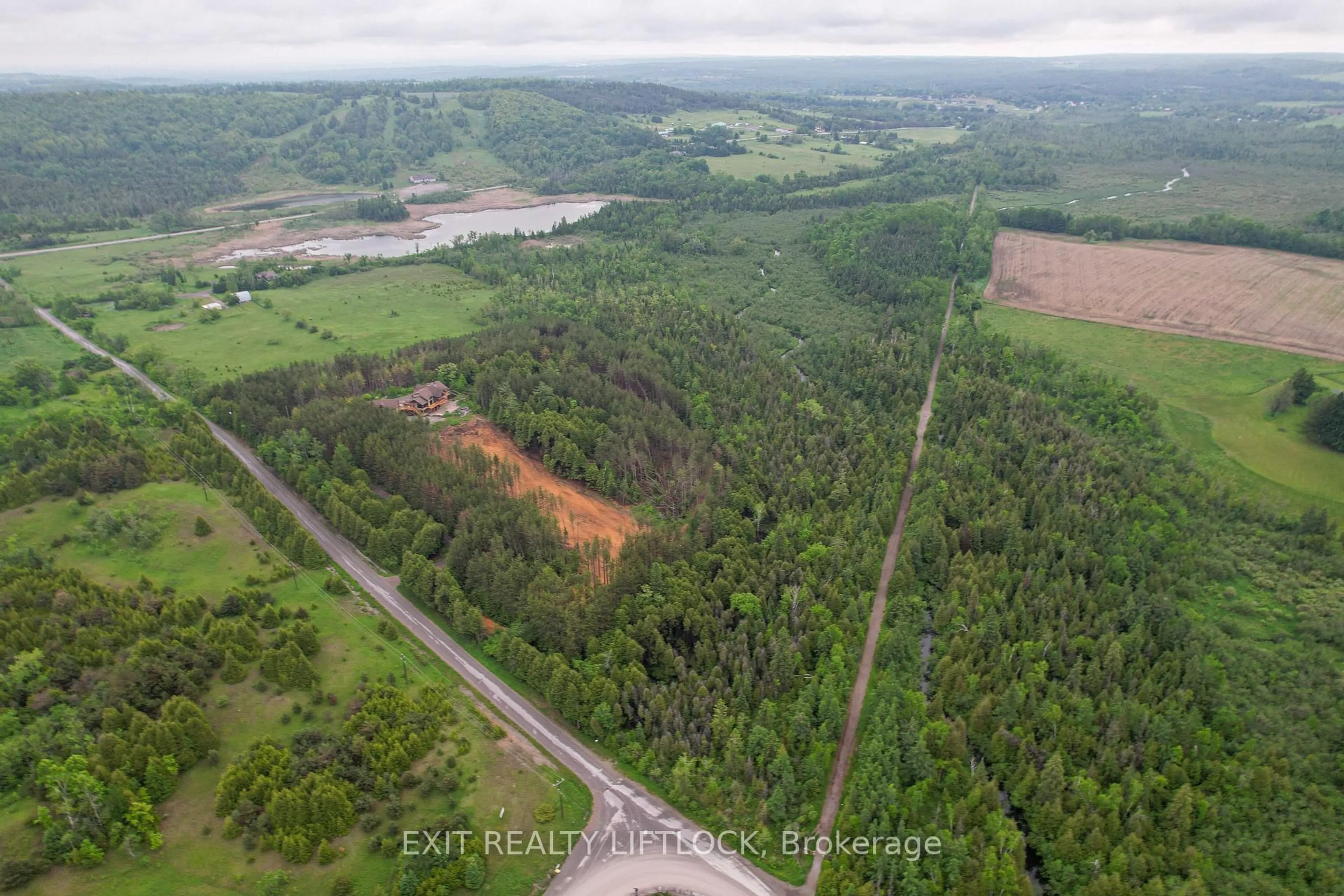 A pic from outside/outdoor area/front of a property/back of a property/a pic from drone, forest/trees view for 758 Lifford Rd, Kawartha Lakes Ontario L0A 1A0