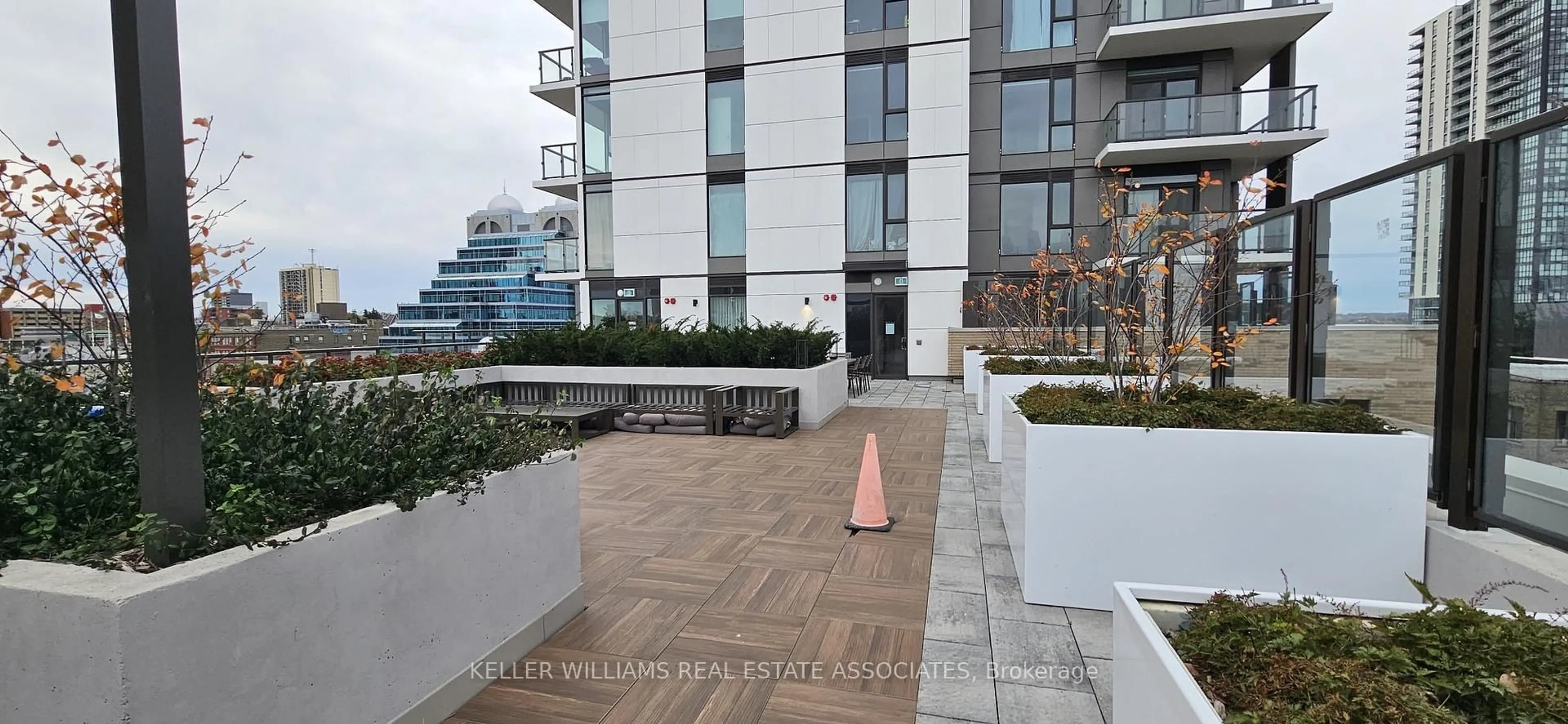 Patio, city buildings view from balcony for 55 Duke St #409, Kitchener Ontario N2H 0C9