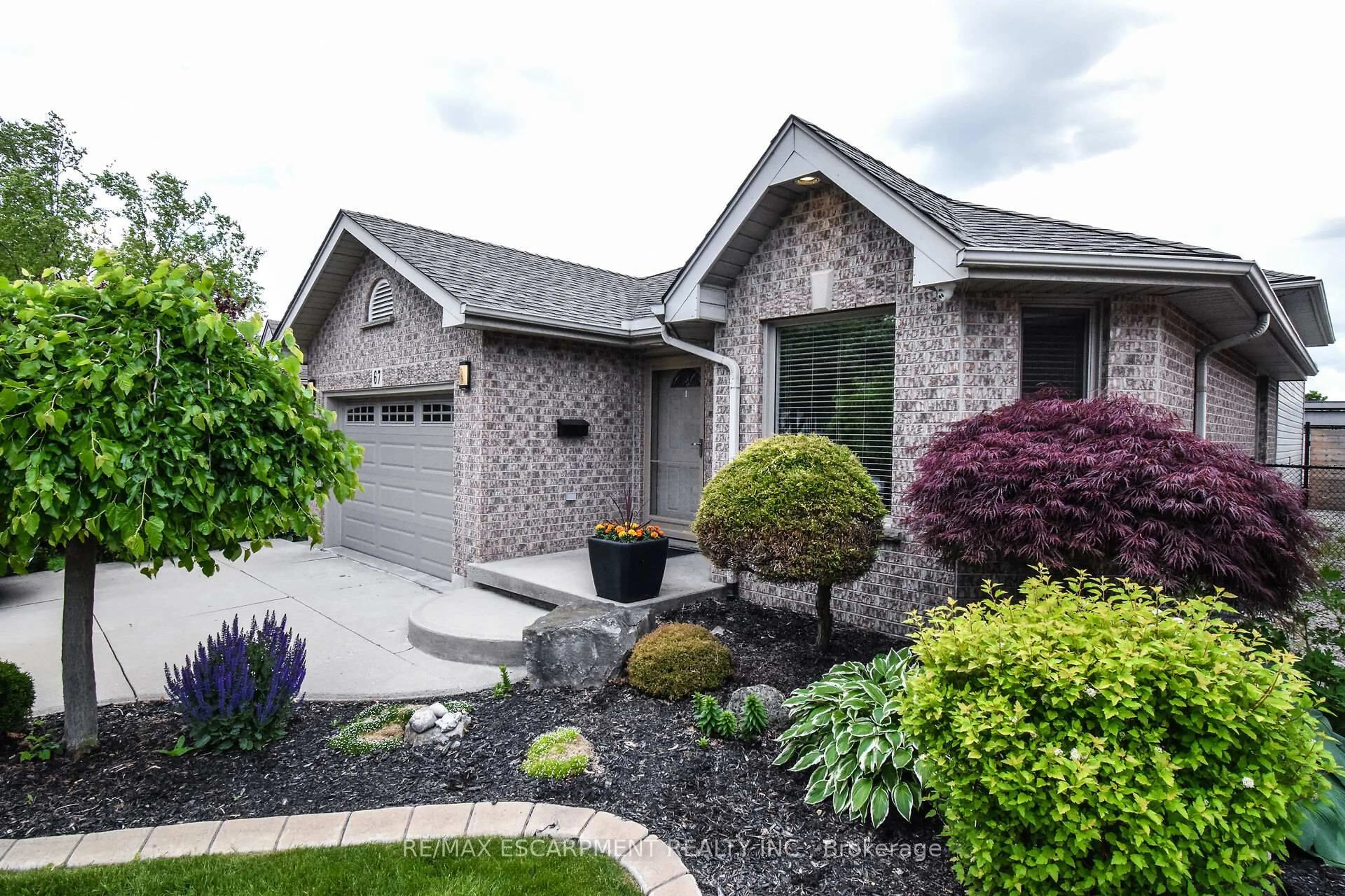 Home with brick exterior material, street for 67 Lawnhurst Dr, Hamilton Ontario L8V 4N9