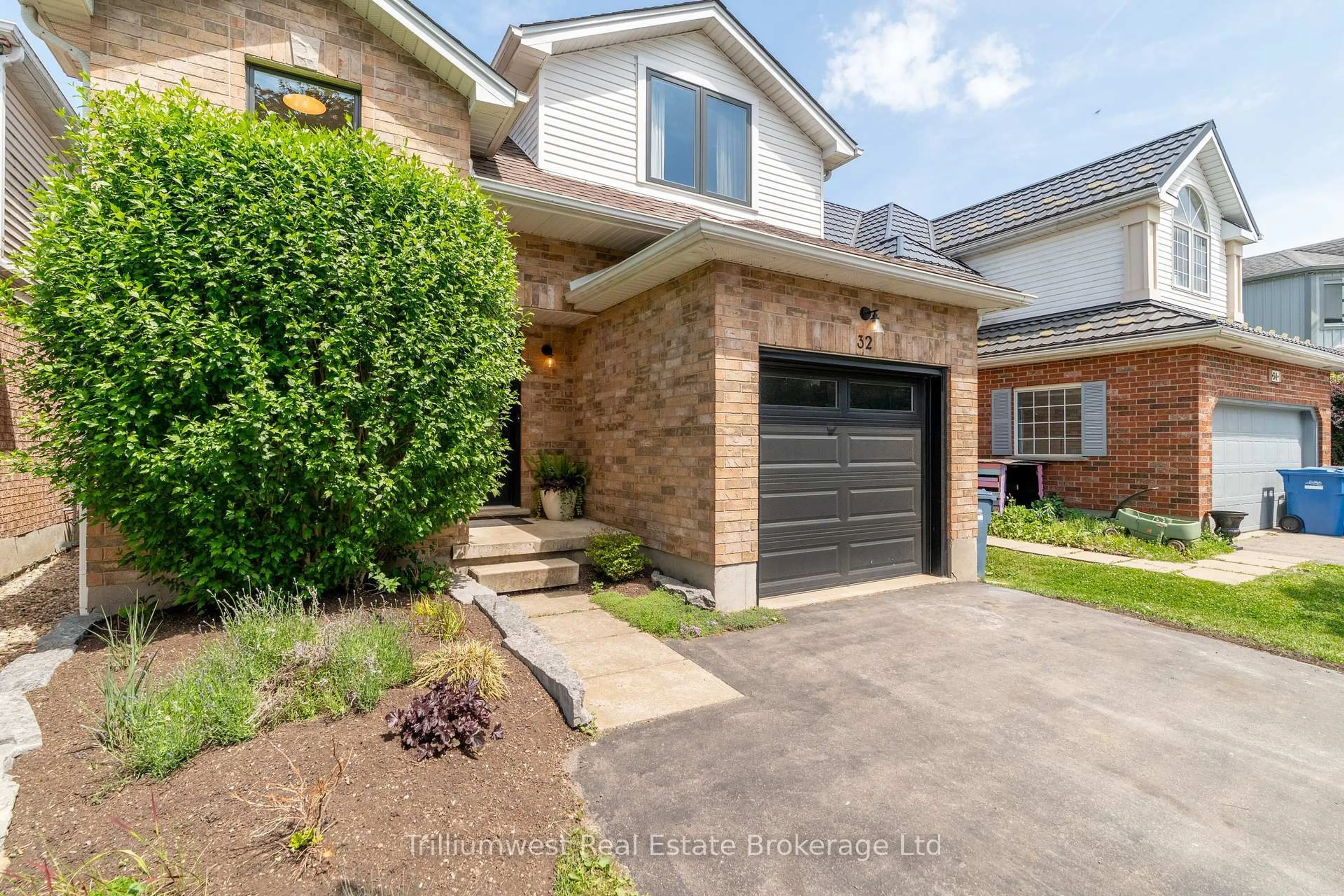 Home with brick exterior material, street for 32 Waxwing Cres, Guelph Ontario N1C 1E1