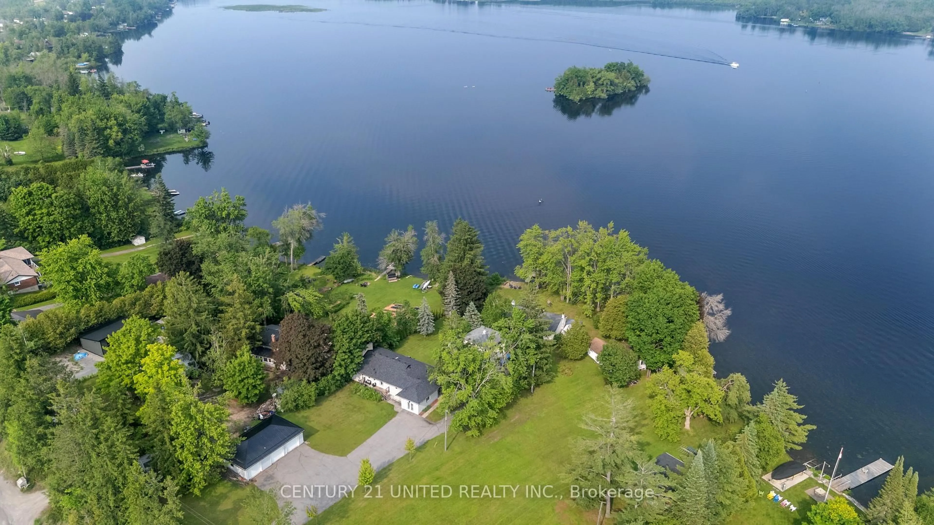 A pic from outside/outdoor area/front of a property/back of a property/a pic from drone, water/lake/river/ocean view for 1749 Youngs Point Rd, Selwyn Ontario K0L 2H0