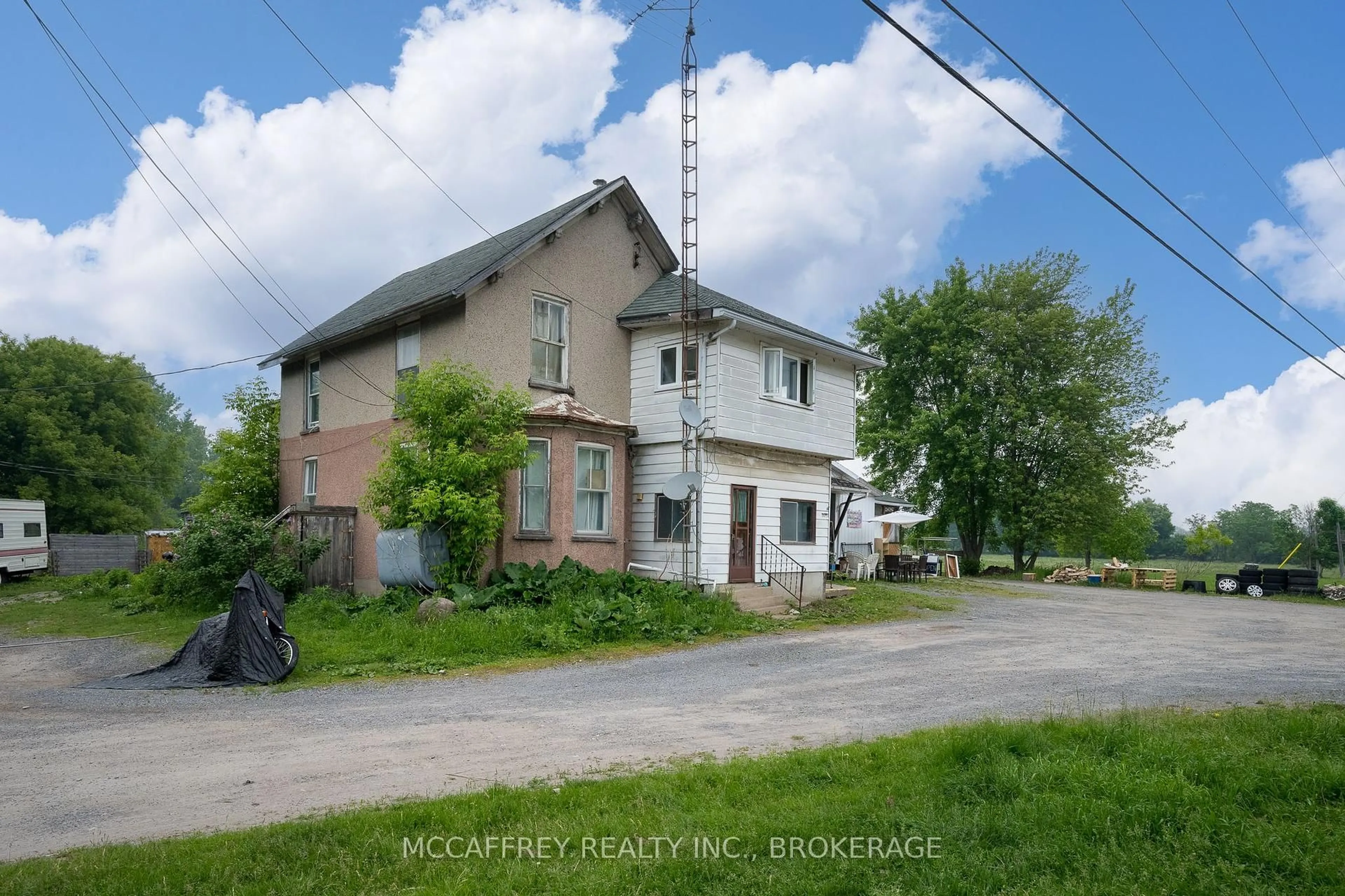 A pic from outside/outdoor area/front of a property/back of a property/a pic from drone, street for 9715 County Road 2 Rd, Greater Napanee Ontario K7R 3L1