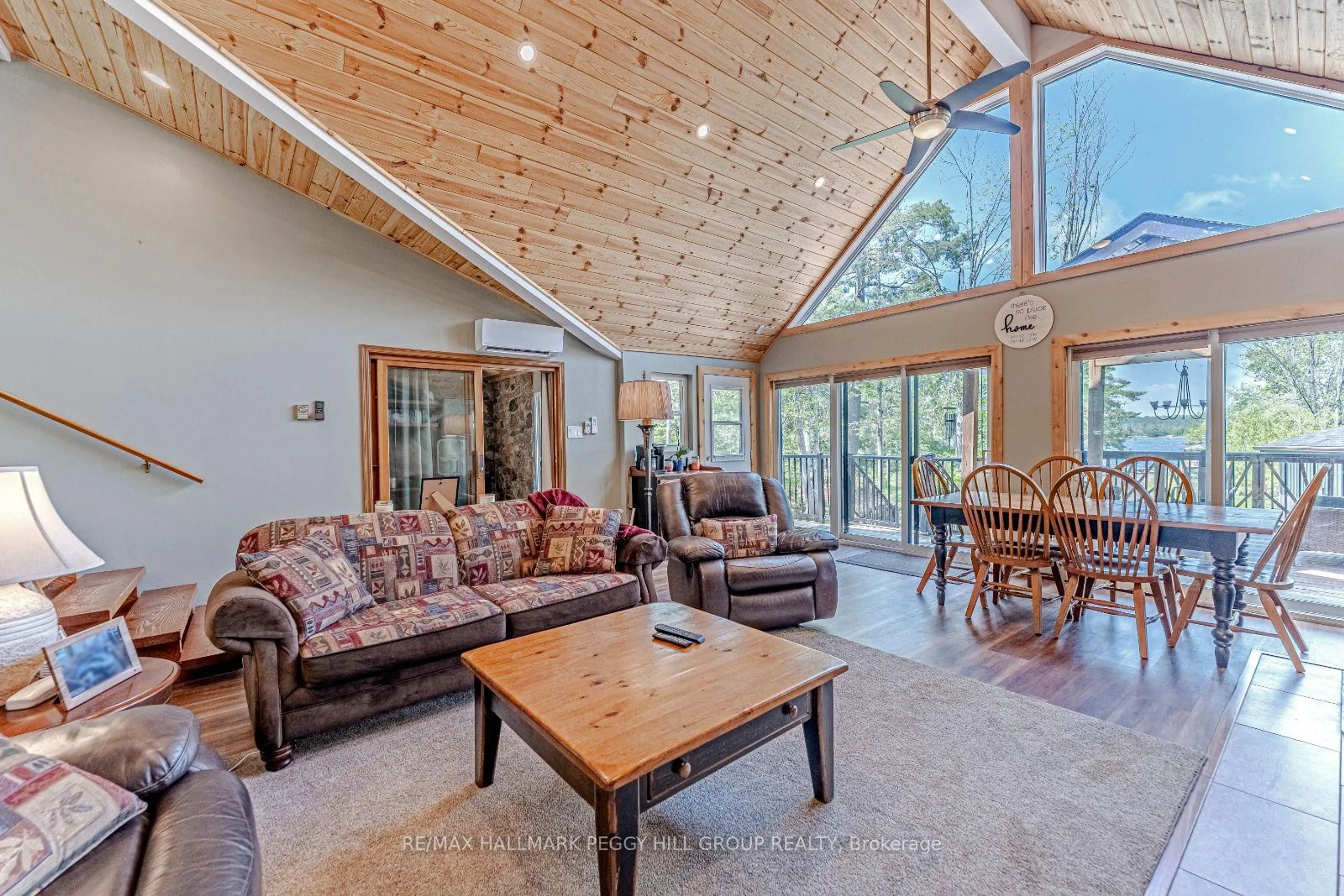 Living room with furniture, wood/laminate floor for 49 Hemlock Dr, Kawartha Lakes Ontario K0M 1C0