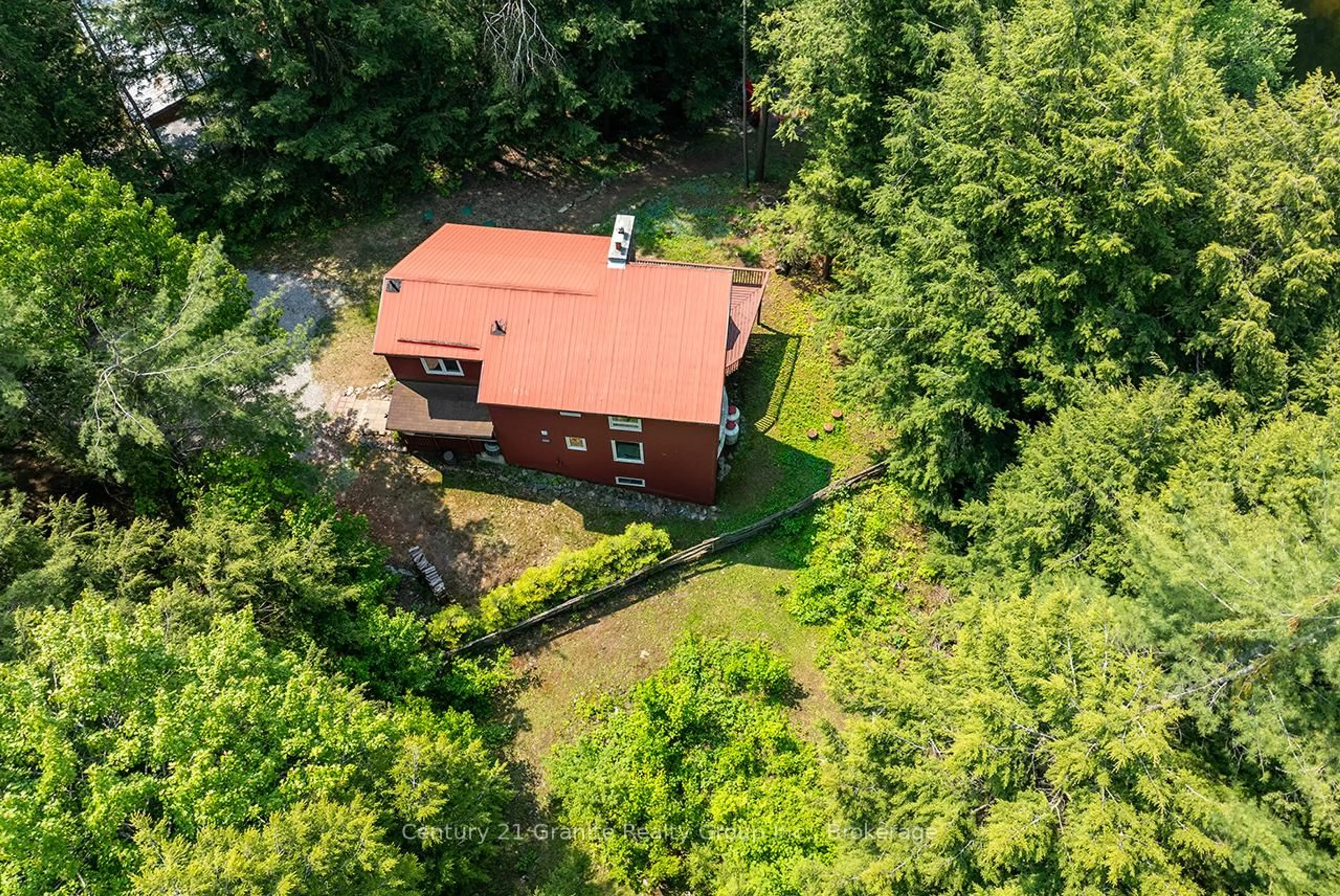 A pic from outside/outdoor area/front of a property/back of a property/a pic from drone, forest/trees view for 85 Nevison Dr, Kawartha Lakes Ontario K0M 2L0