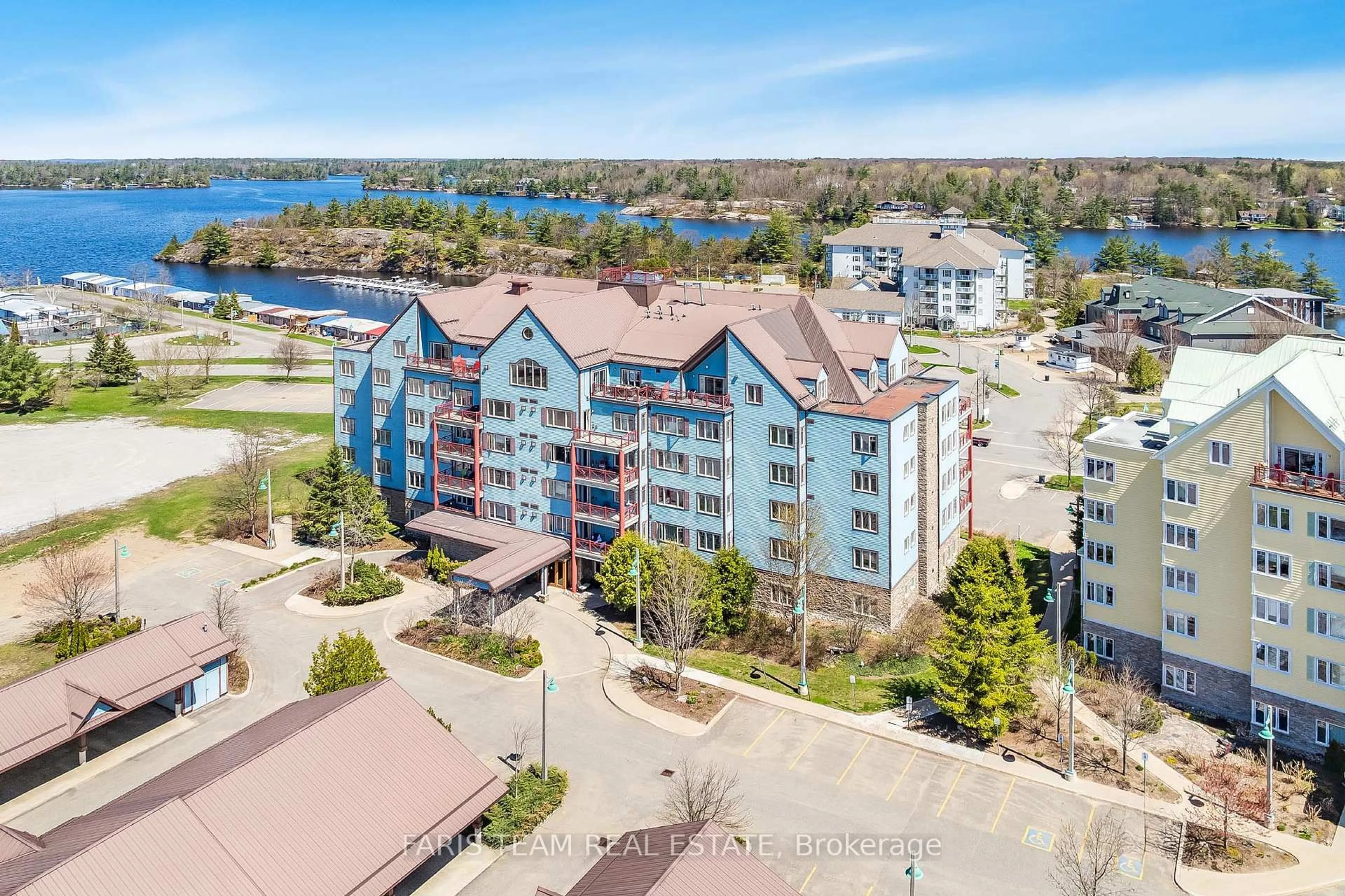 A pic from outside/outdoor area/front of a property/back of a property/a pic from drone, water/lake/river/ocean view for 130 Steamship Bay Rd #204, Gravenhurst Ontario P1P 1Z9